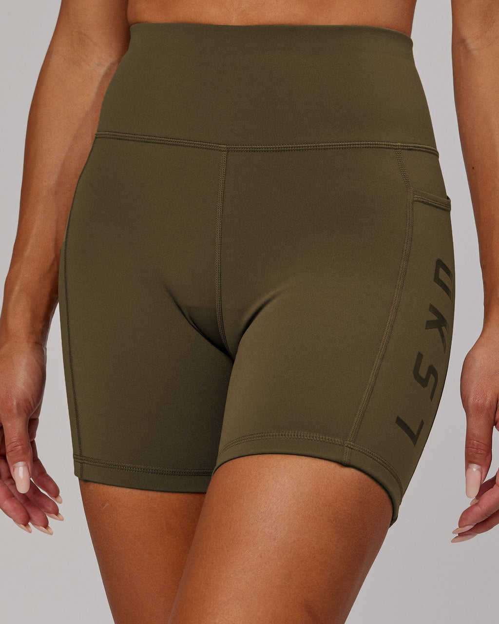 Model wearing Rep Mid Short Tight - Army Green