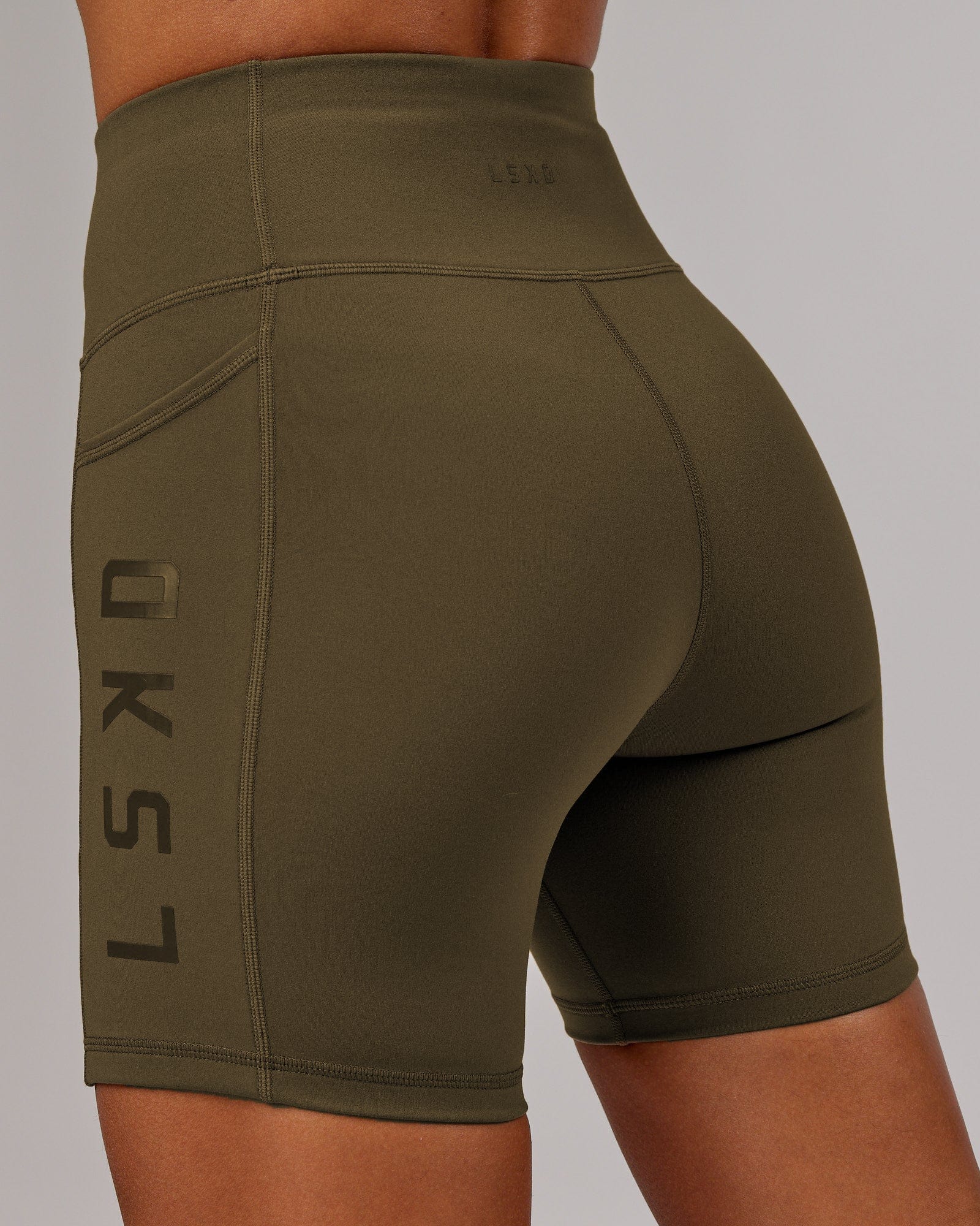 Model wearing Rep Mid Short Tight - Army Green