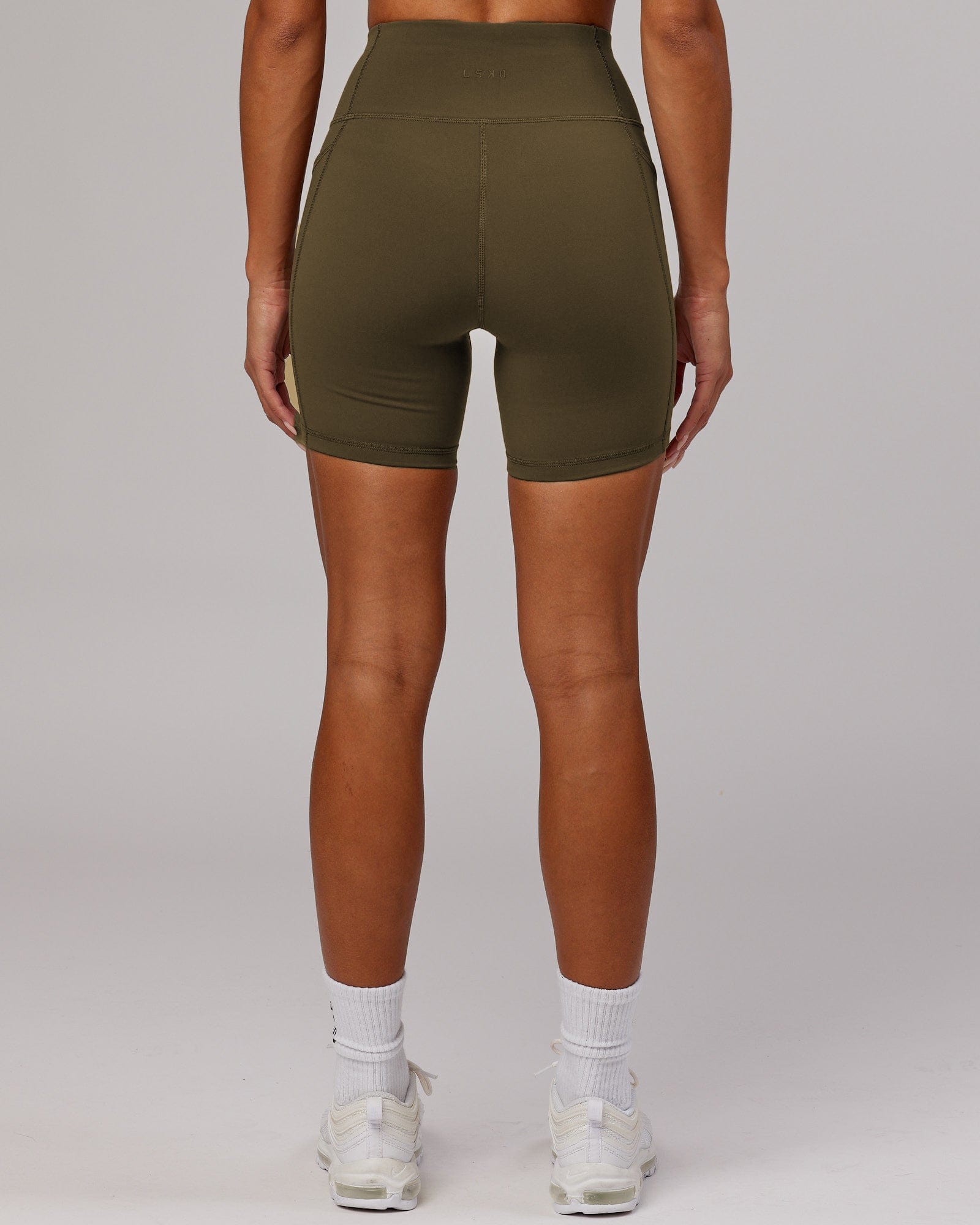 Model wearing Rep Mid Short Tight - Army Green