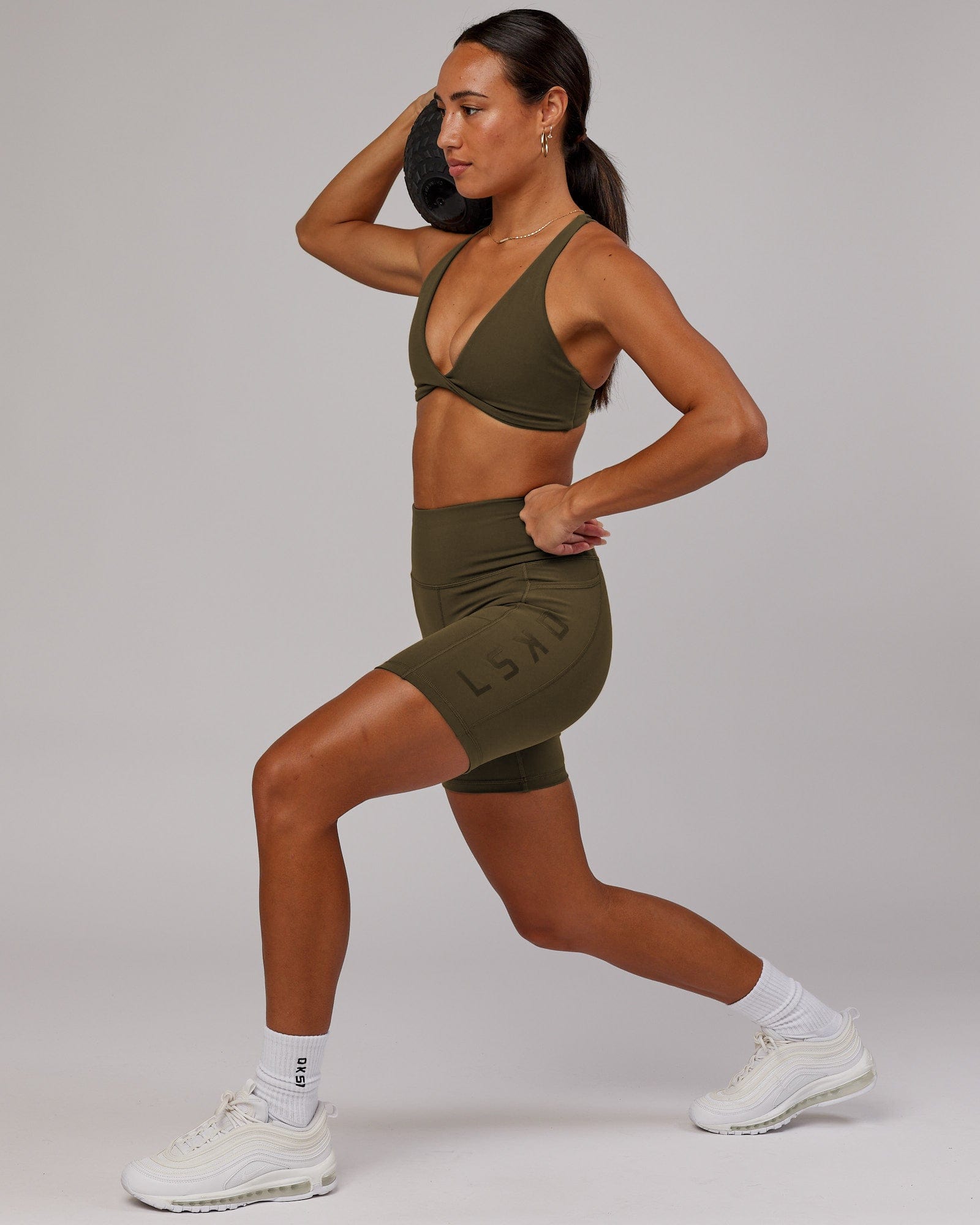 Model wearing Rep Mid Short Tight - Army Green