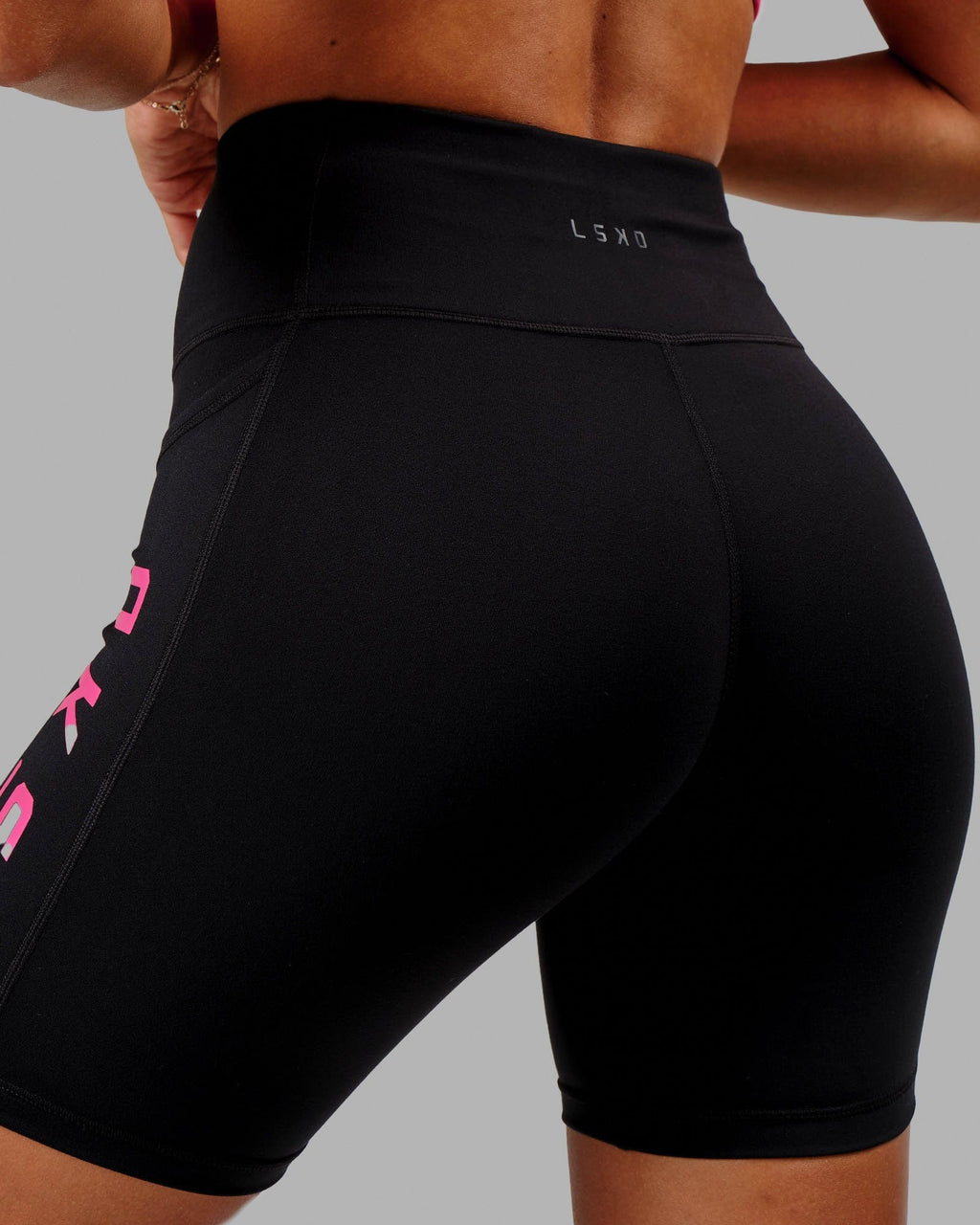 Model wearing Rep Mid Short Tight - Black-Boysenberry