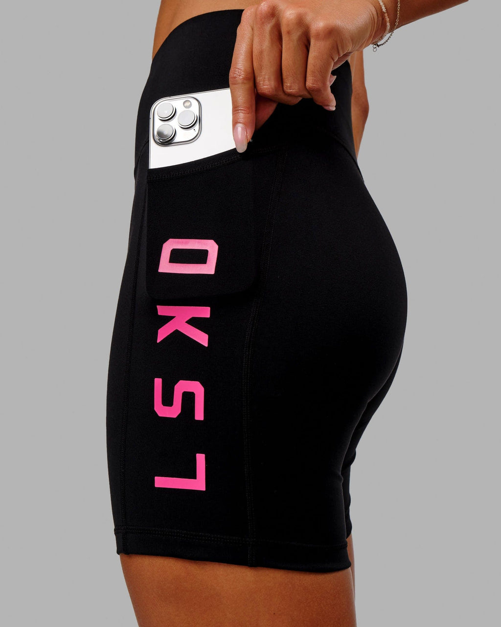 Model wearing Rep Mid Short Tight - Black-Boysenberry