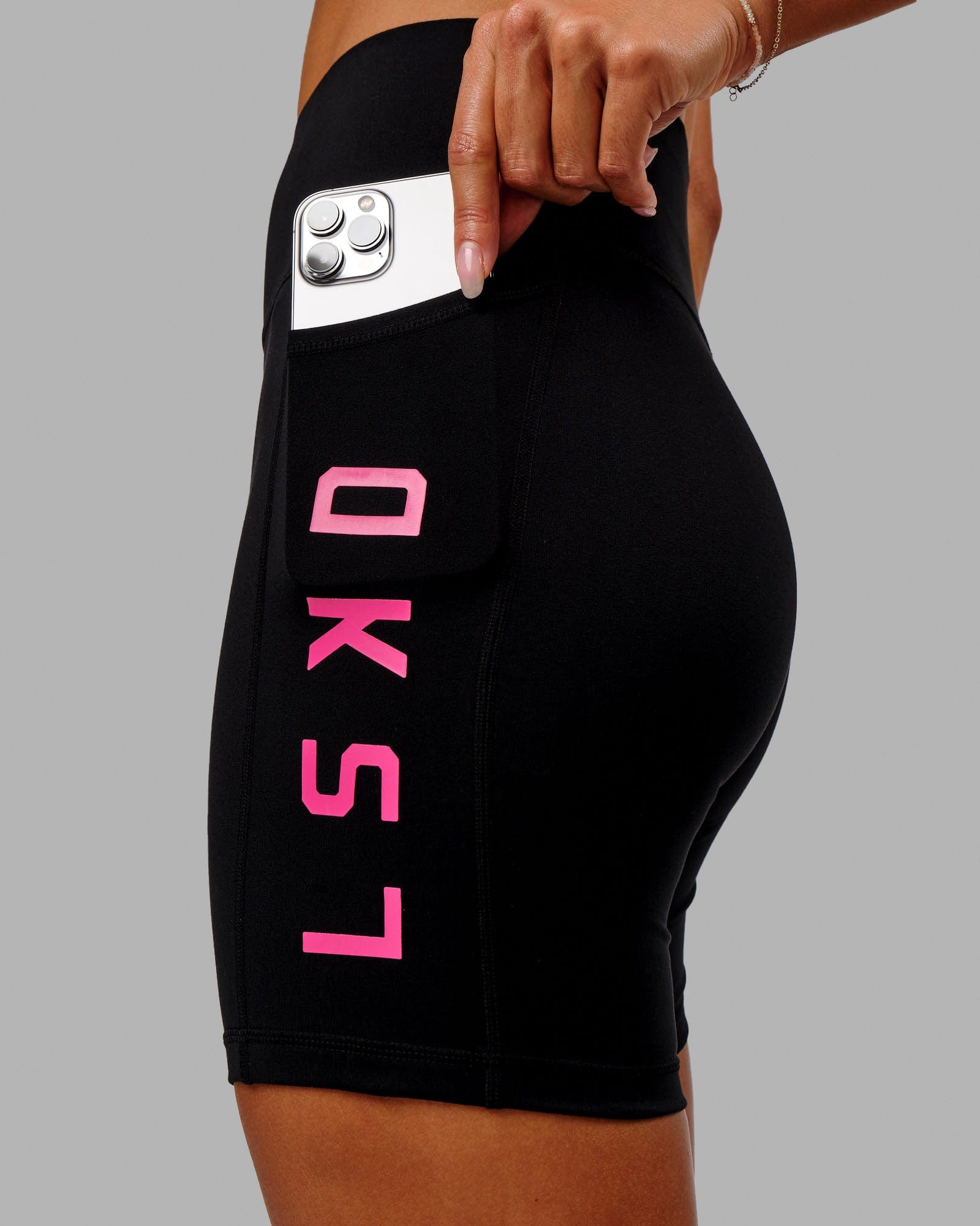 Model wearing Rep Mid Short Tight - Black-Boysenberry