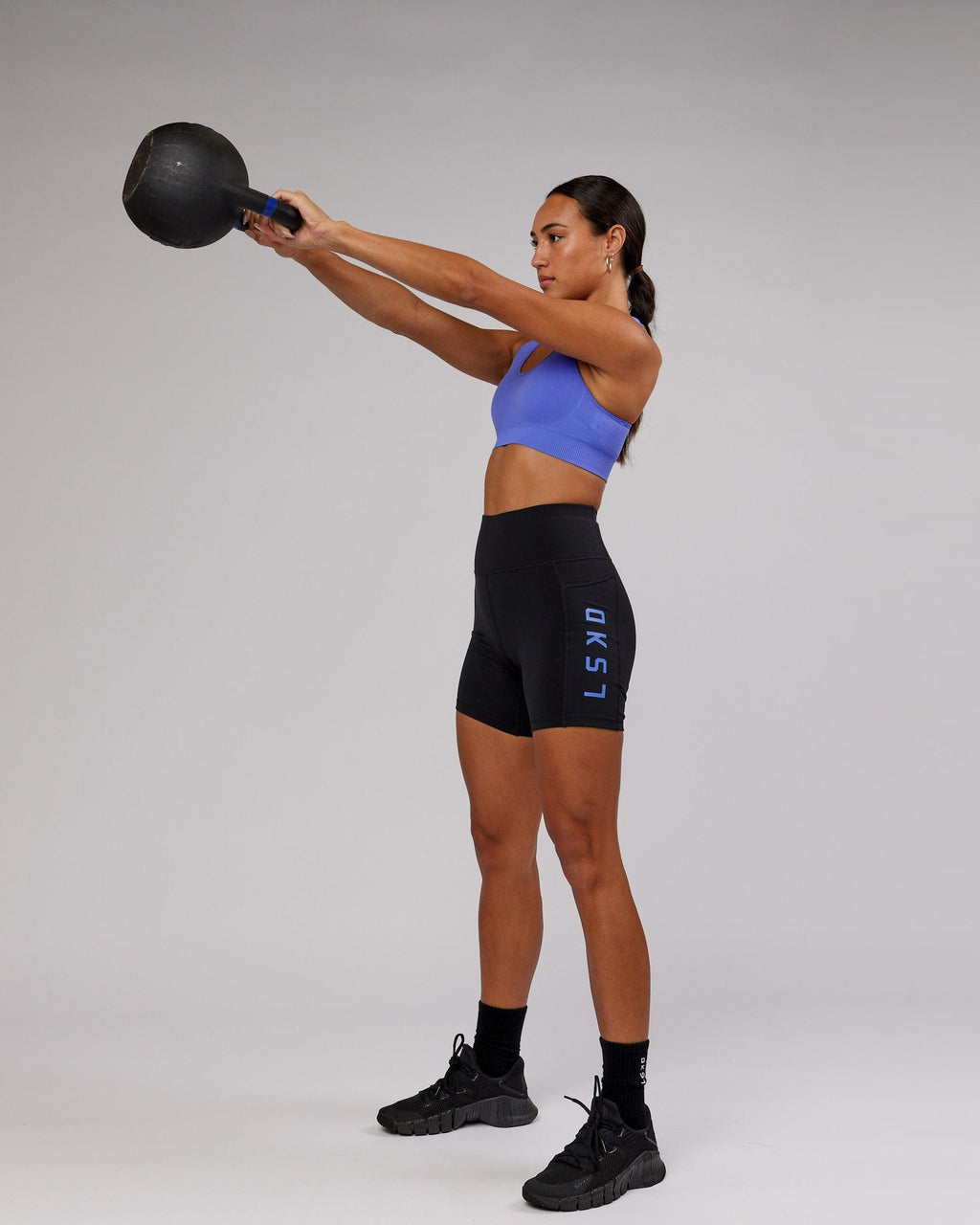 Model wearing Rep Mid Short Tight - Black-Cornflower Blue