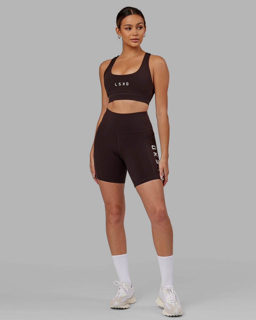 Model wearing Rep Mid Short Tight - Dark Walnut