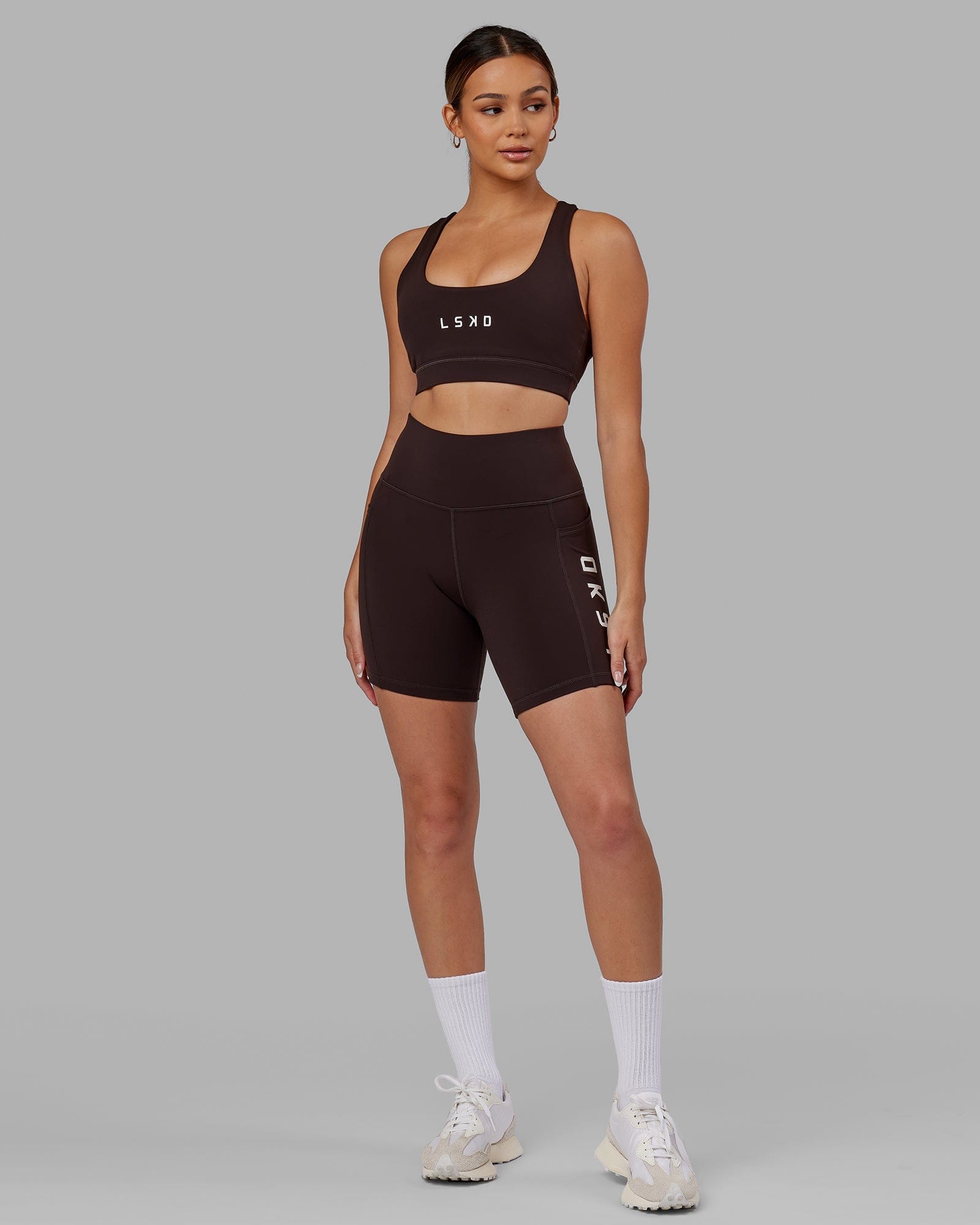 Model wearing Rep Mid Short Tight - Dark Walnut