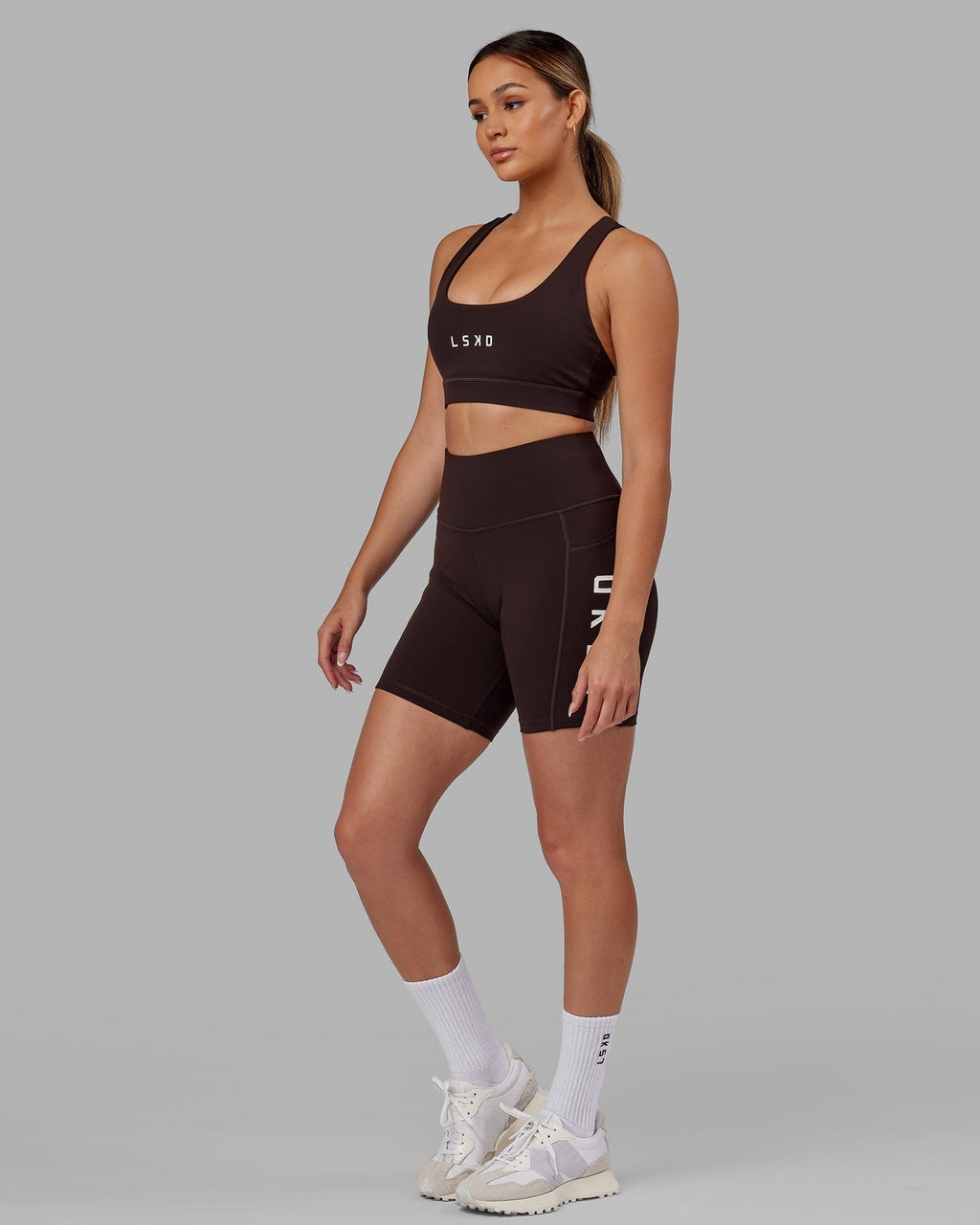 Model wearing Rep Mid Short Tight - Dark Walnut