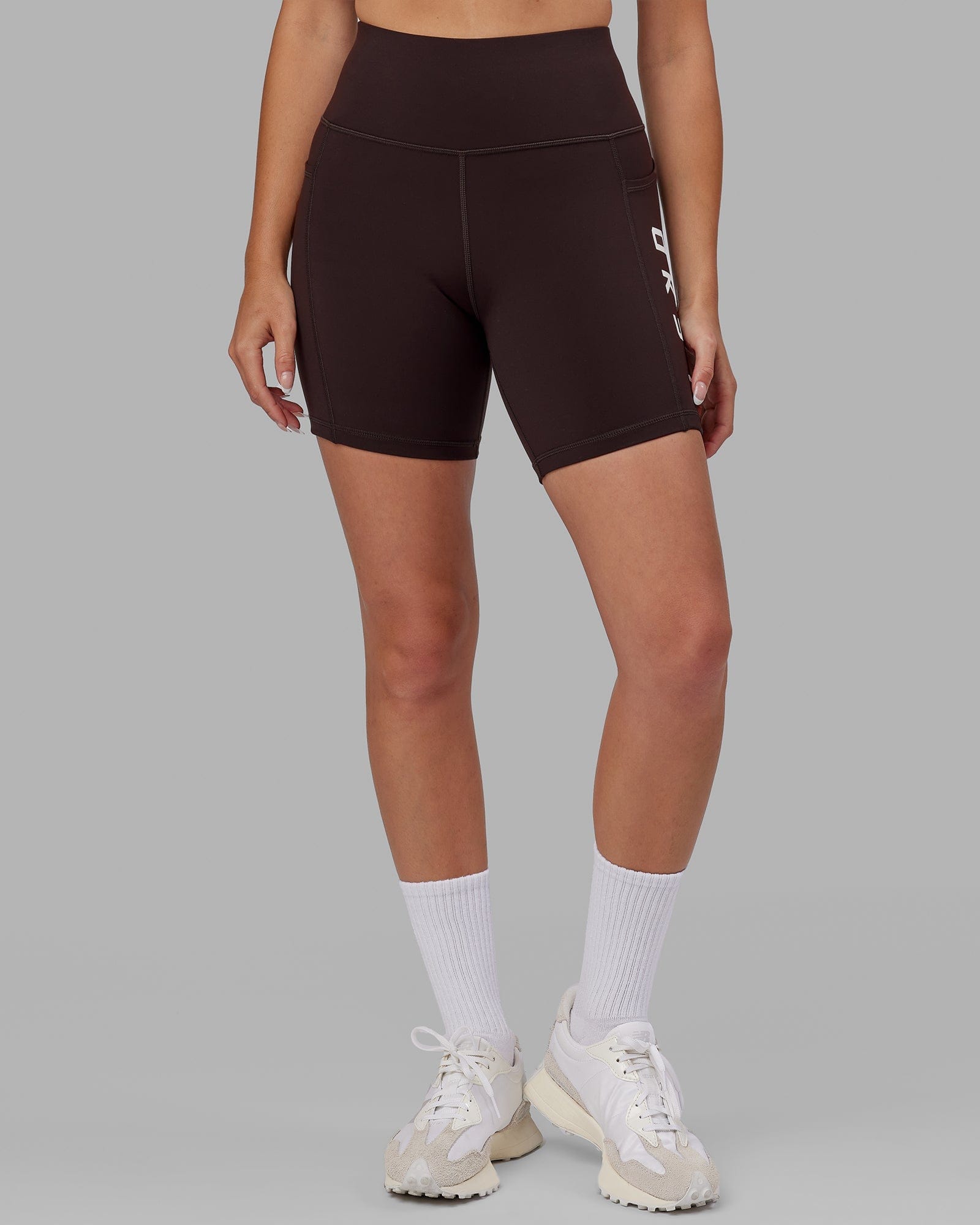 Model wearing Rep Mid Short Tight - Dark Walnut