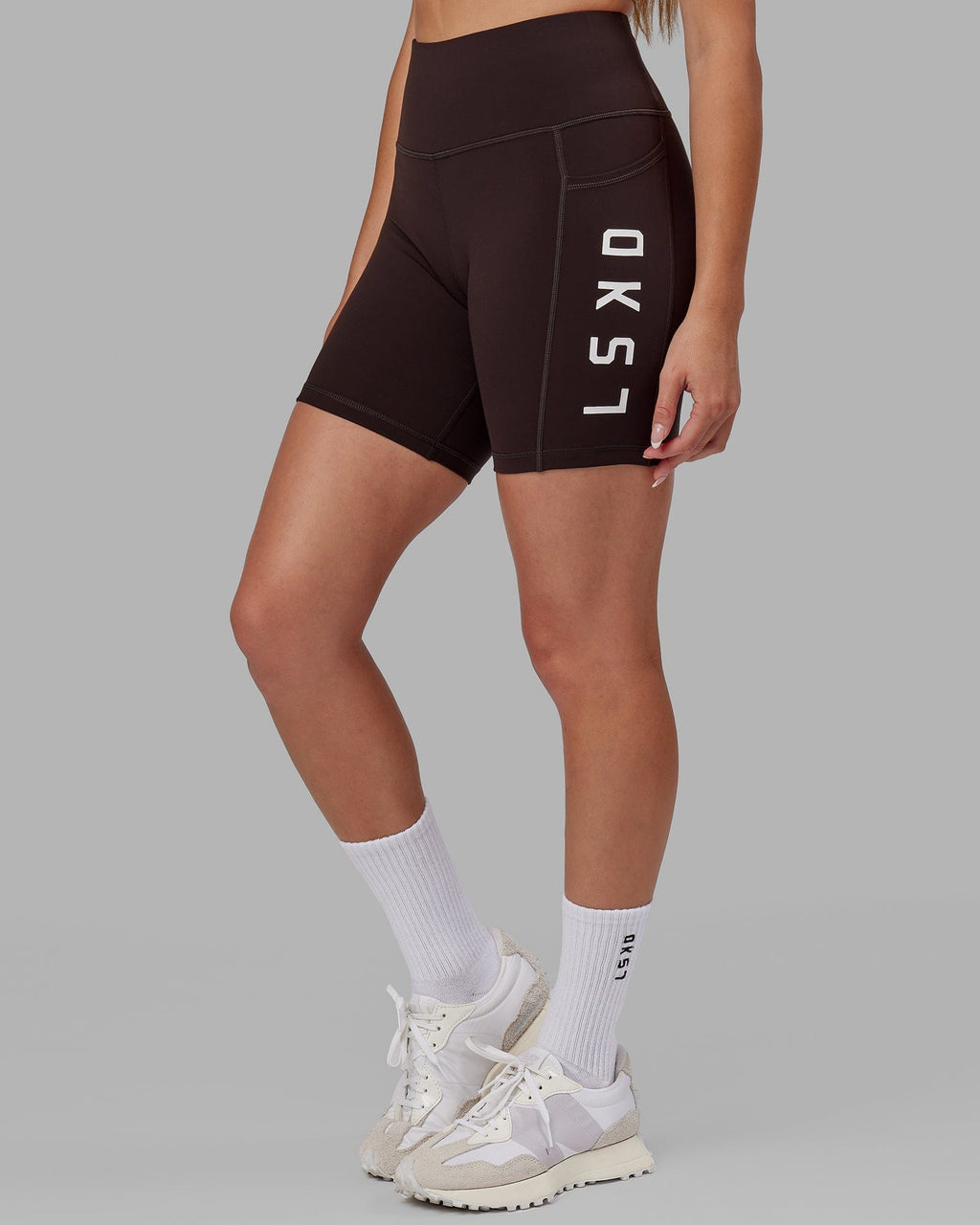 Model wearing Rep Mid Short Tight - Dark Walnut