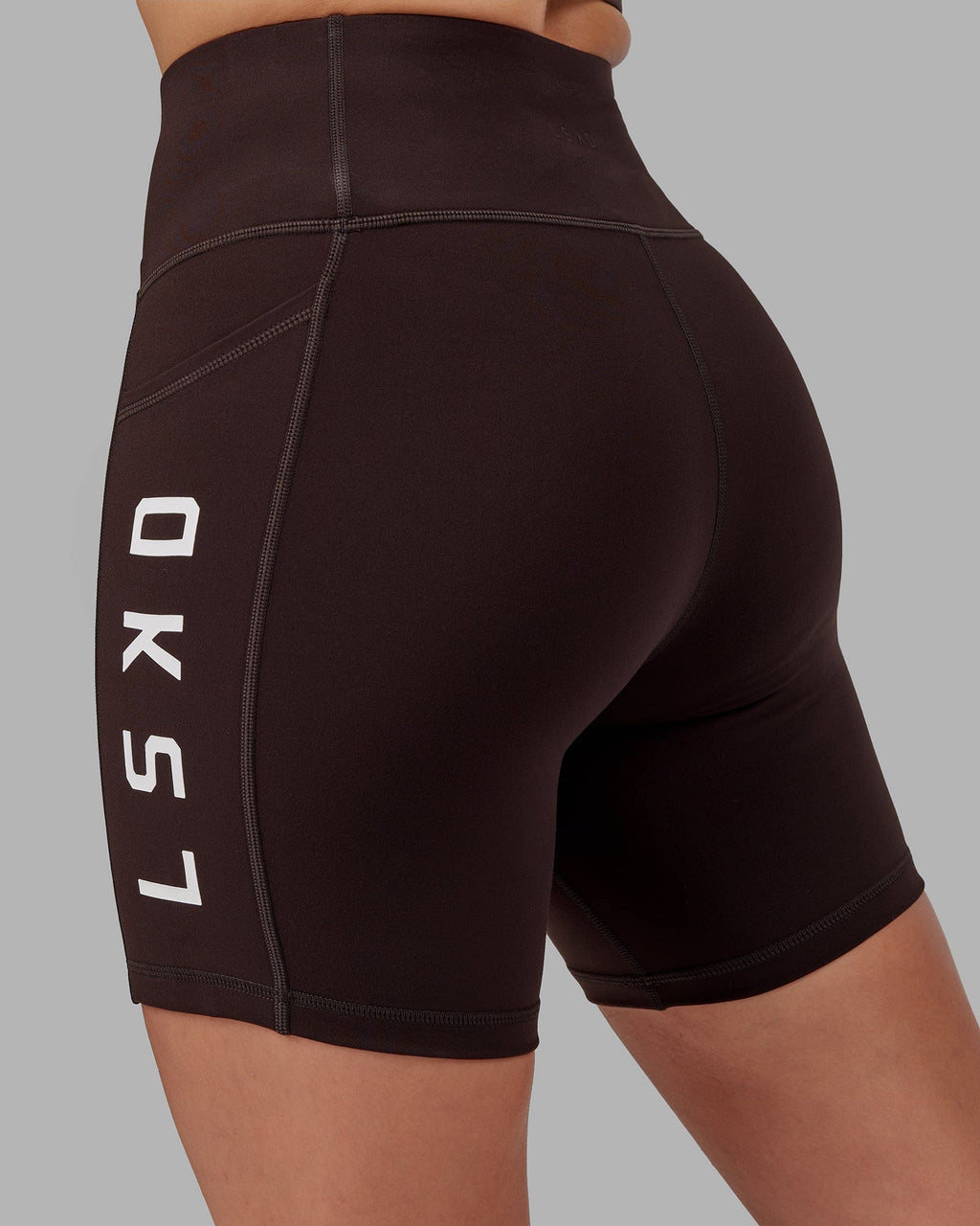 Model wearing Rep Mid Short Tight - Dark Walnut