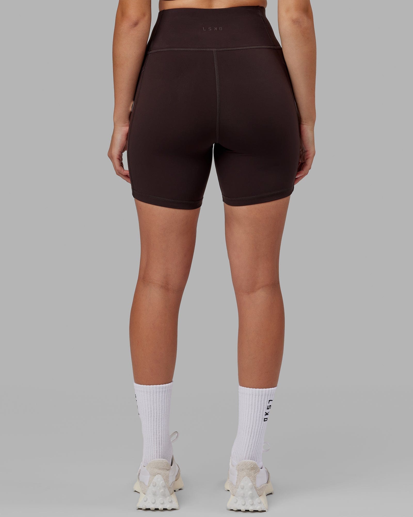 Model wearing Rep Mid Short Tight - Dark Walnut