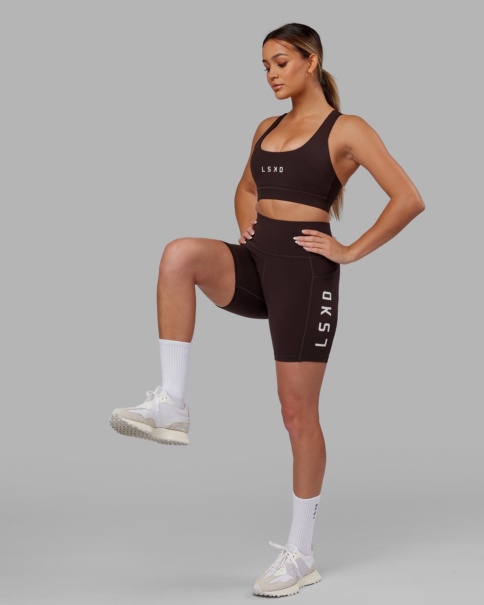 Model wearing Rep Mid Short Tight - Dark Walnut