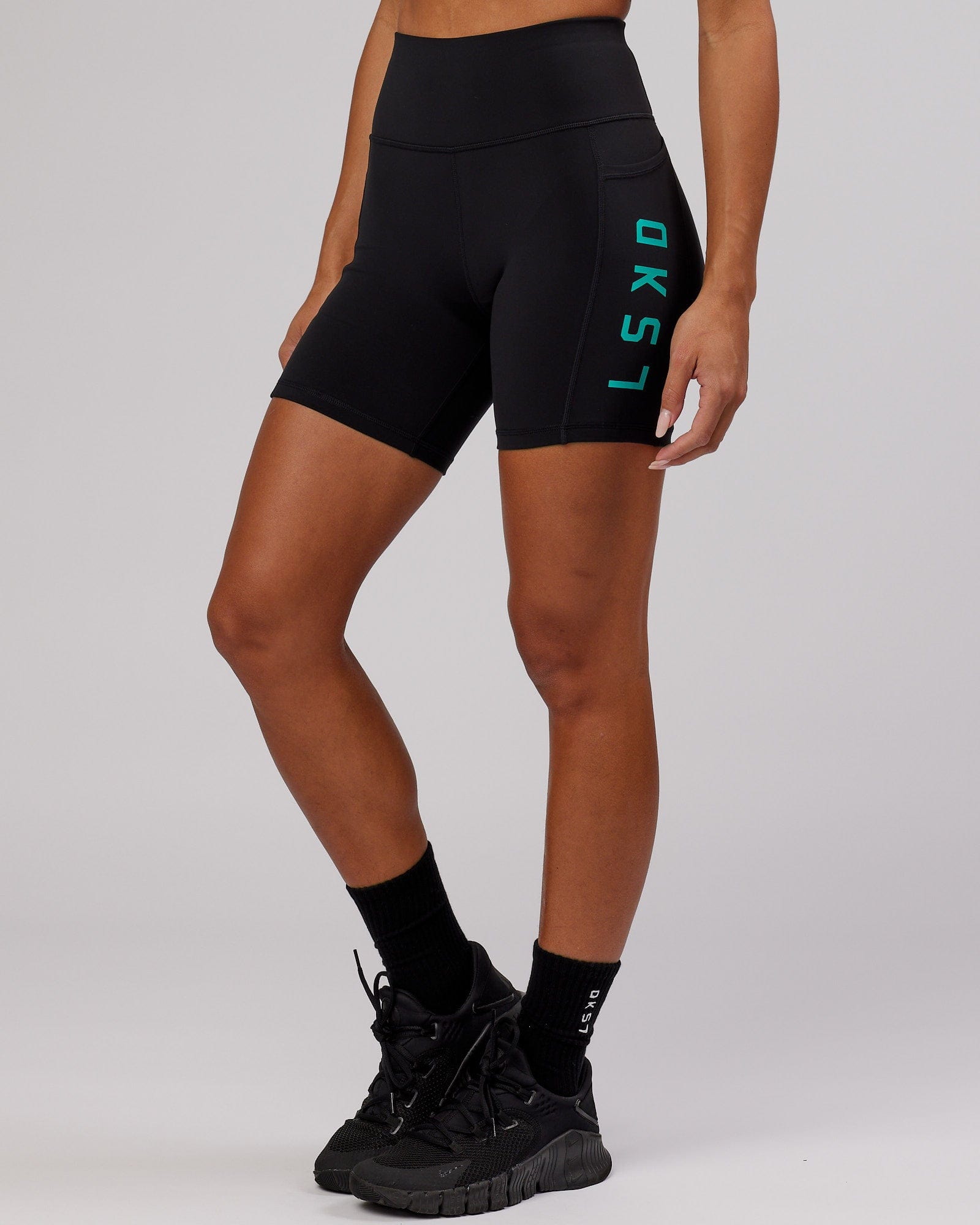 Model wearing Rep Mid Short Tight - Black-Hyper Teal