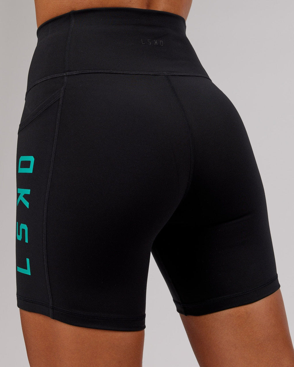 Model wearing Rep Mid Short Tight - Black-Hyper Teal