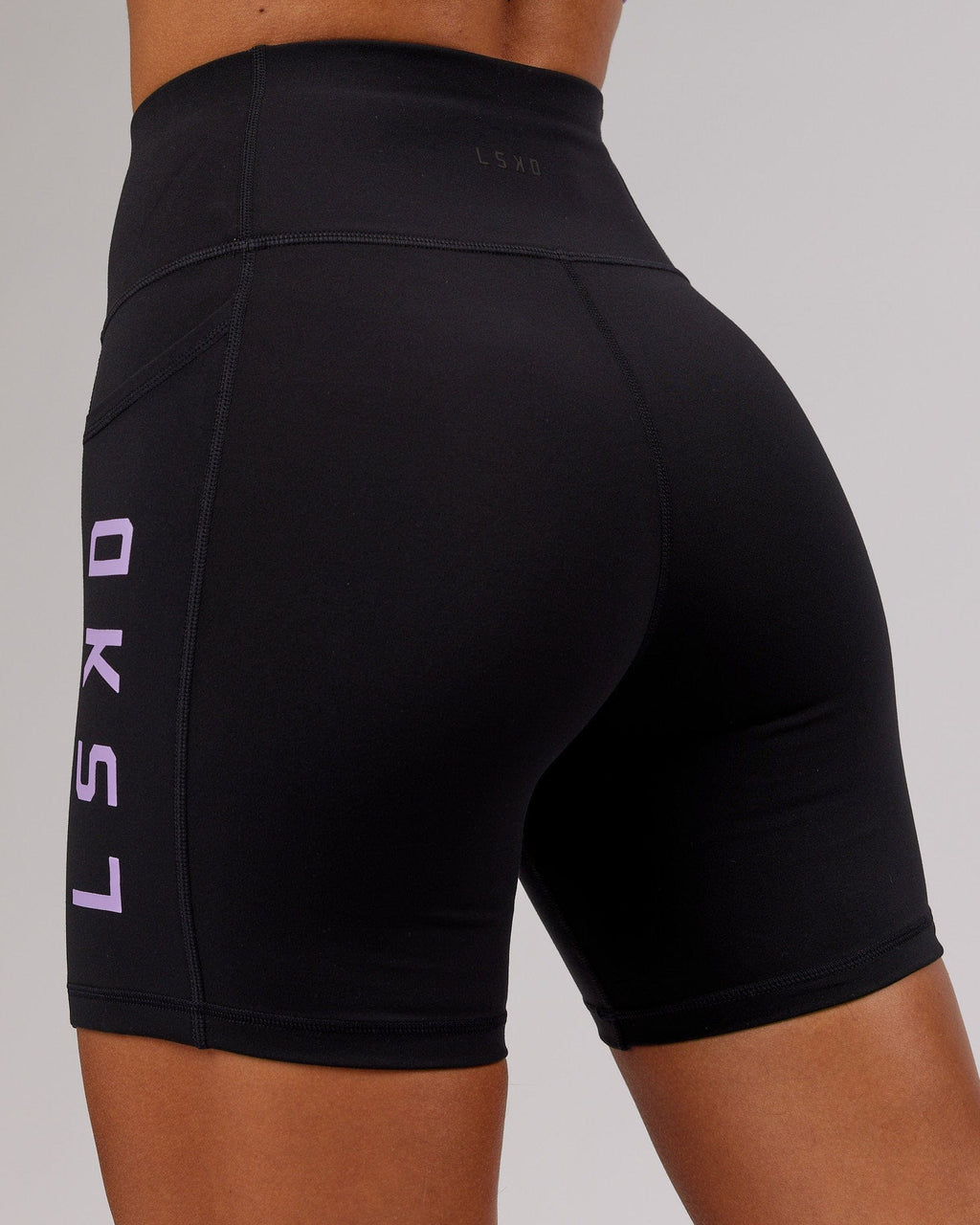 Model wearing Rep Mid Short Tight - Black-Lilac
