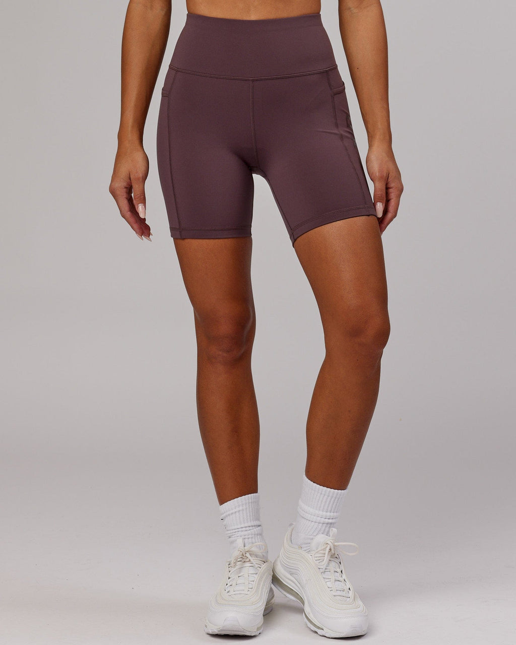 Model wearing Rep Mid Short Tight - Plum