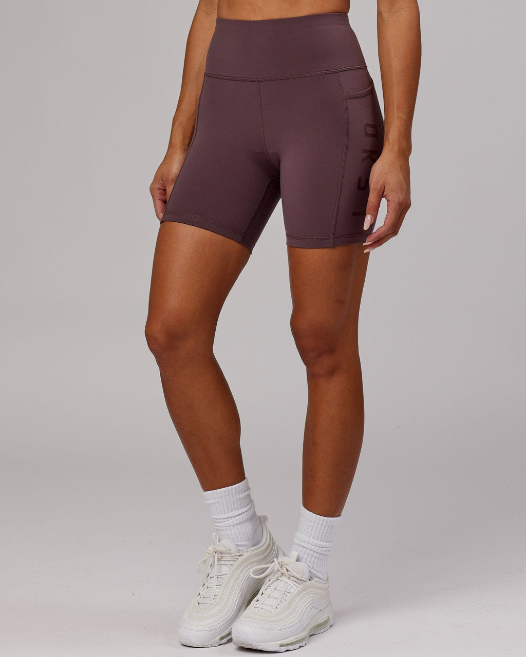 Model wearing Rep Mid Short Tight - Plum