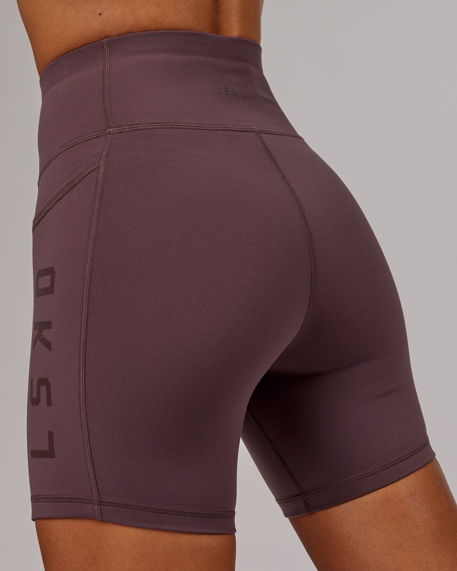 Model wearing Rep Mid Short Tight - Plum
