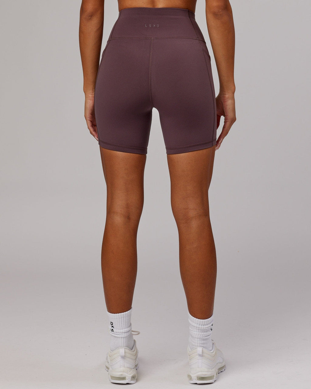 Model wearing Rep Mid Short Tight - Plum