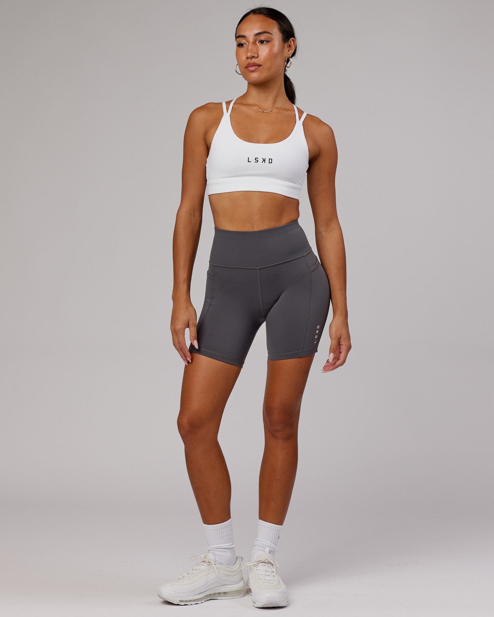 Model wearing Rep Mid Short Tight Small Logo - Asphalt