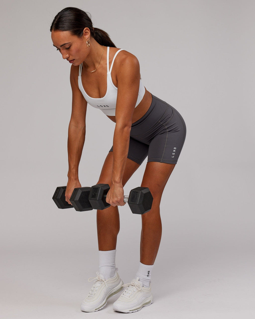 Model wearing Rep Mid Short Tight Small Logo - Asphalt