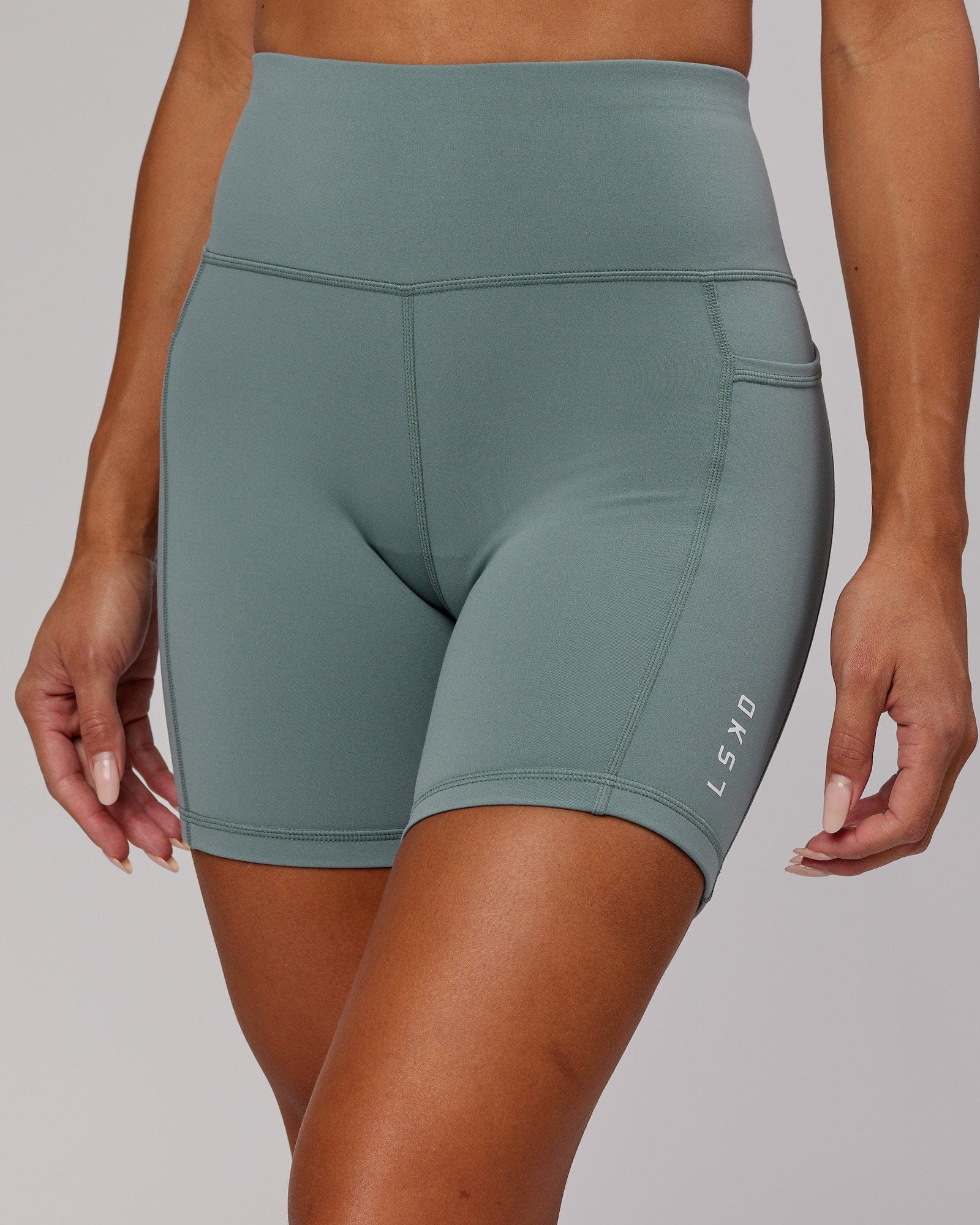 Model wearing Rep Mid Short Tight Small Logo - Eclipse