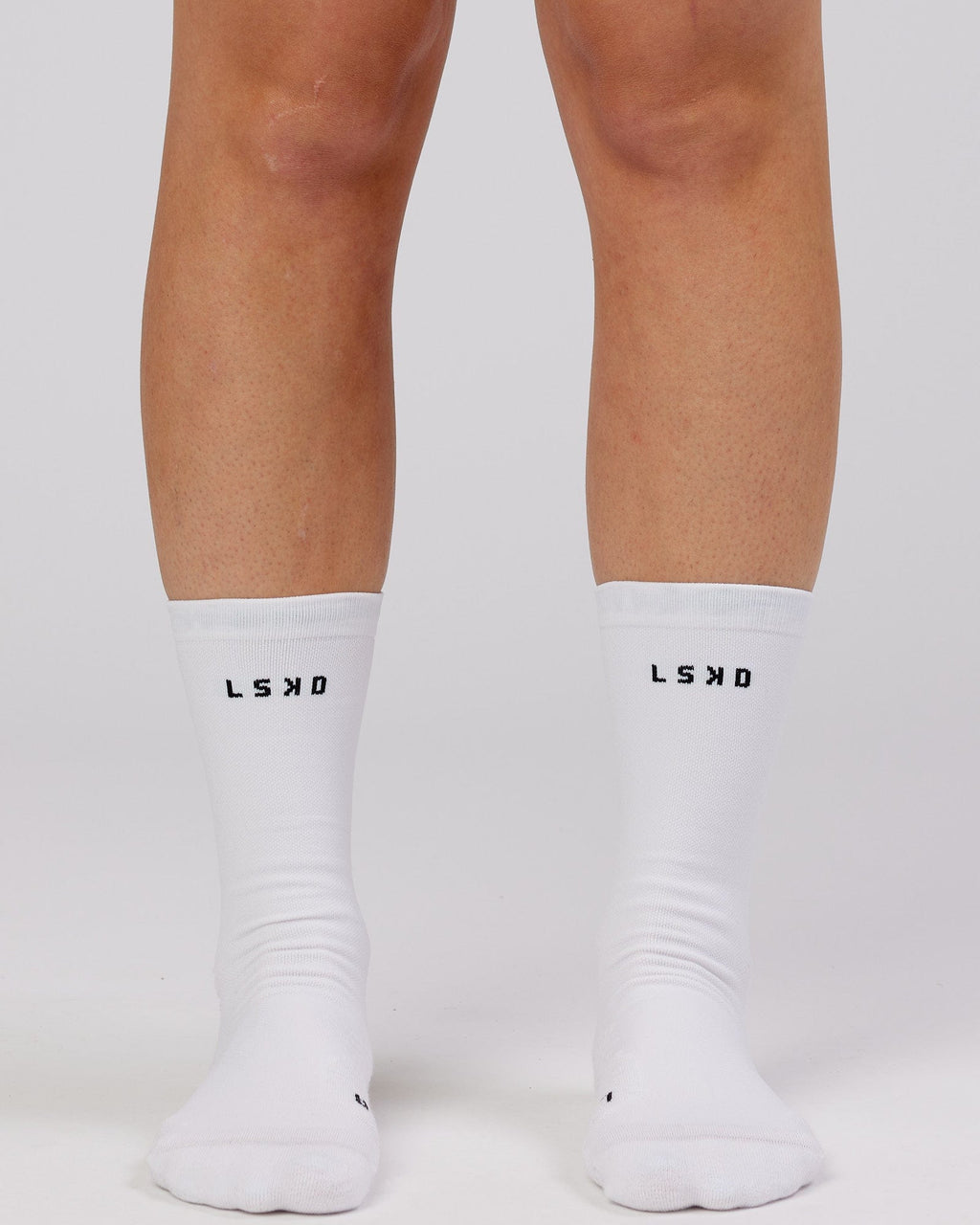 Model wearing Rep Performance Crew Sock - White
