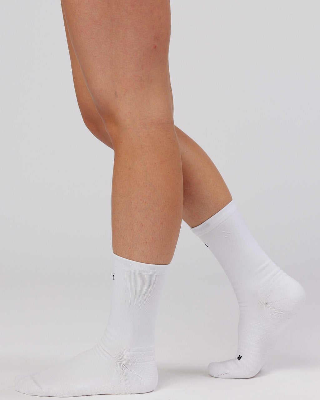 Model wearing Rep Performance Crew Sock - White