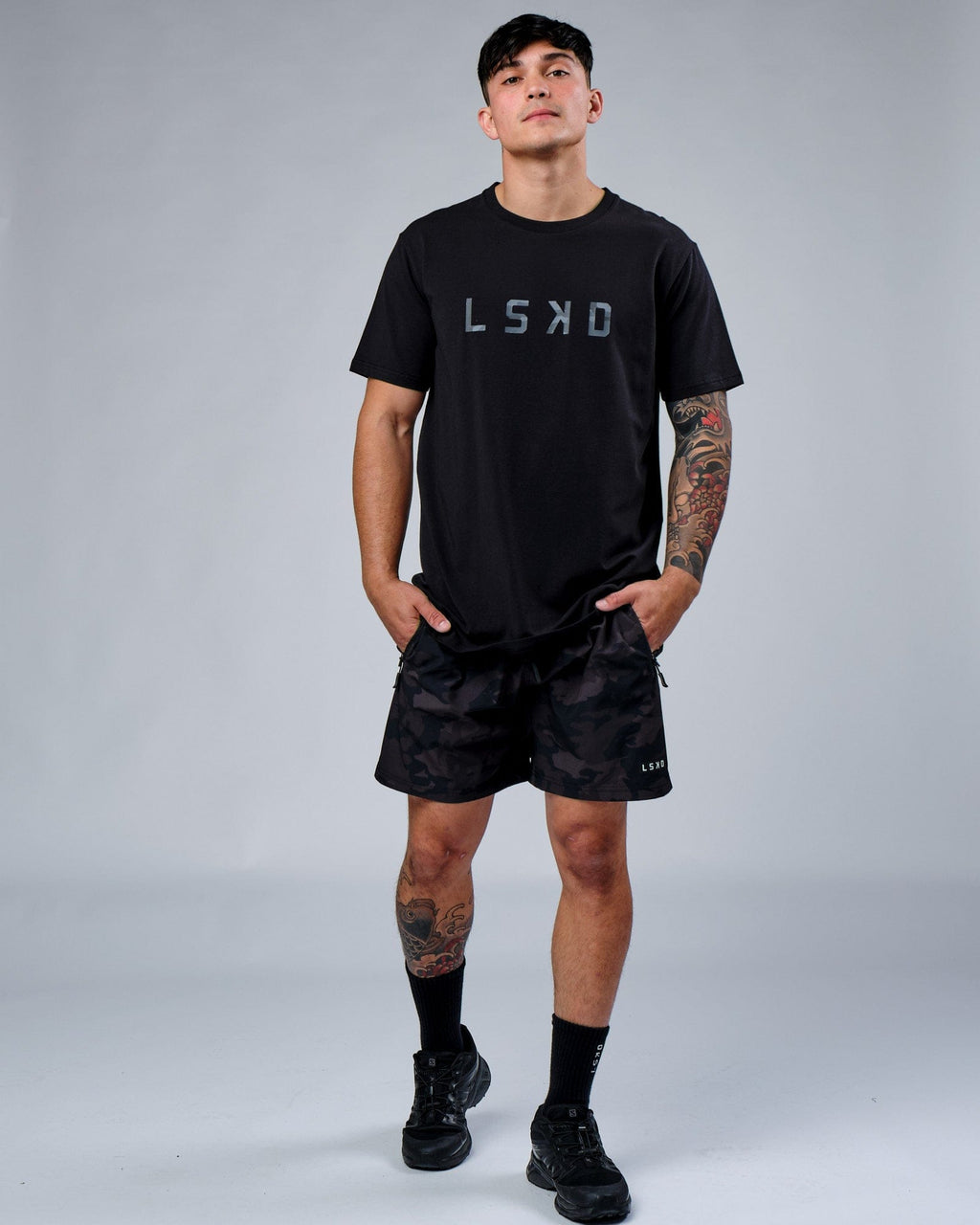 Model wearing Rep 7" Performance Short - Black Camo