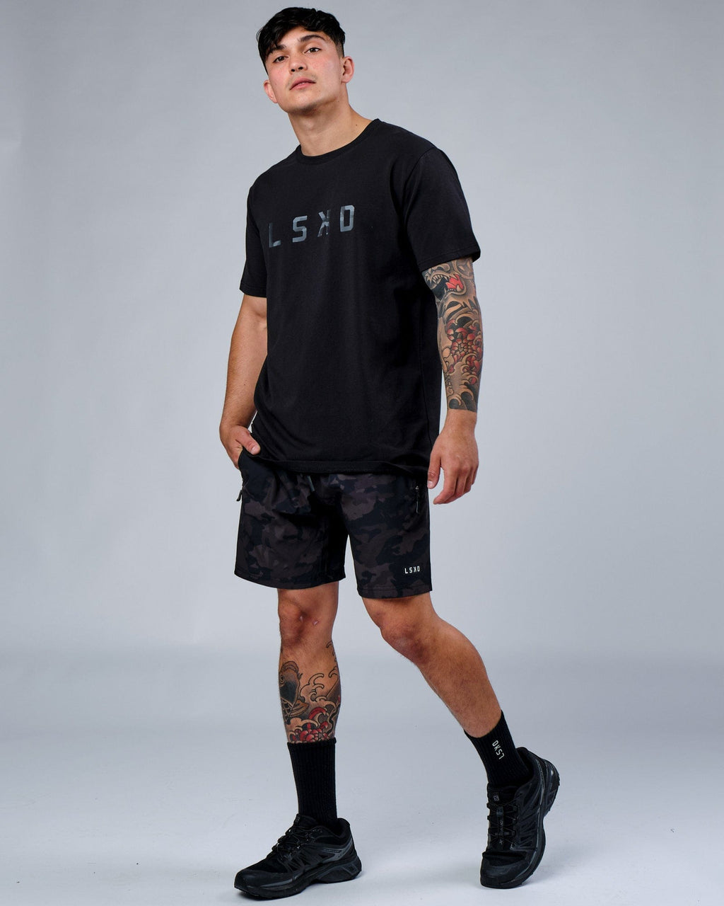 Model wearing Rep 7" Performance Short - Black Camo