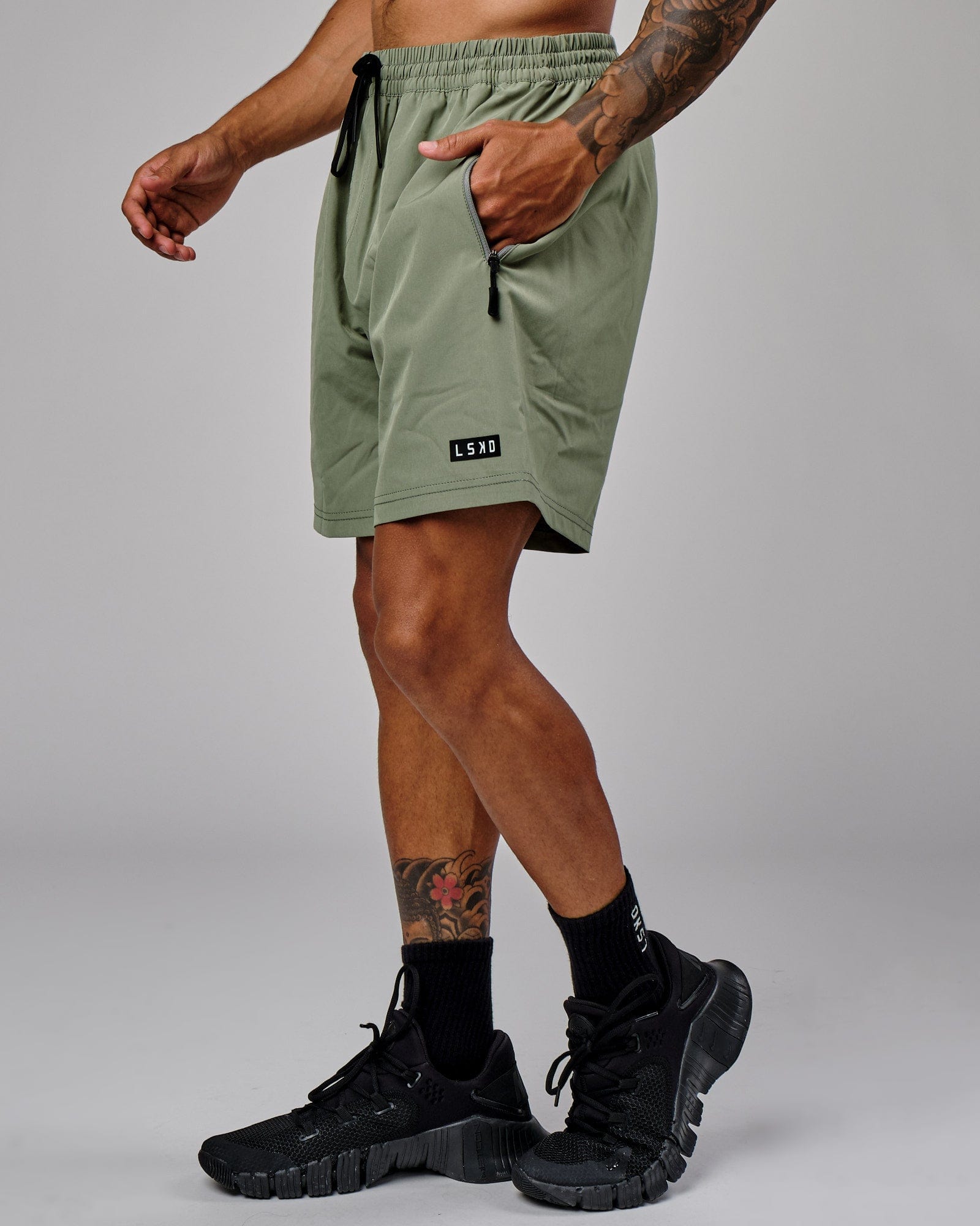 Model wearing Rep 7'' Performance Short - Sea Spray