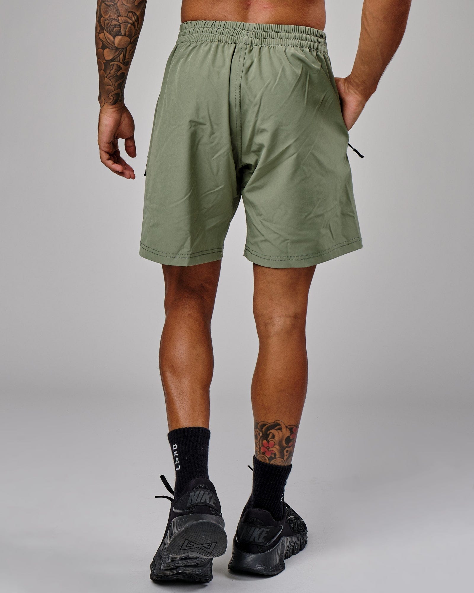 Model wearing Rep 7'' Performance Short - Sea Spray