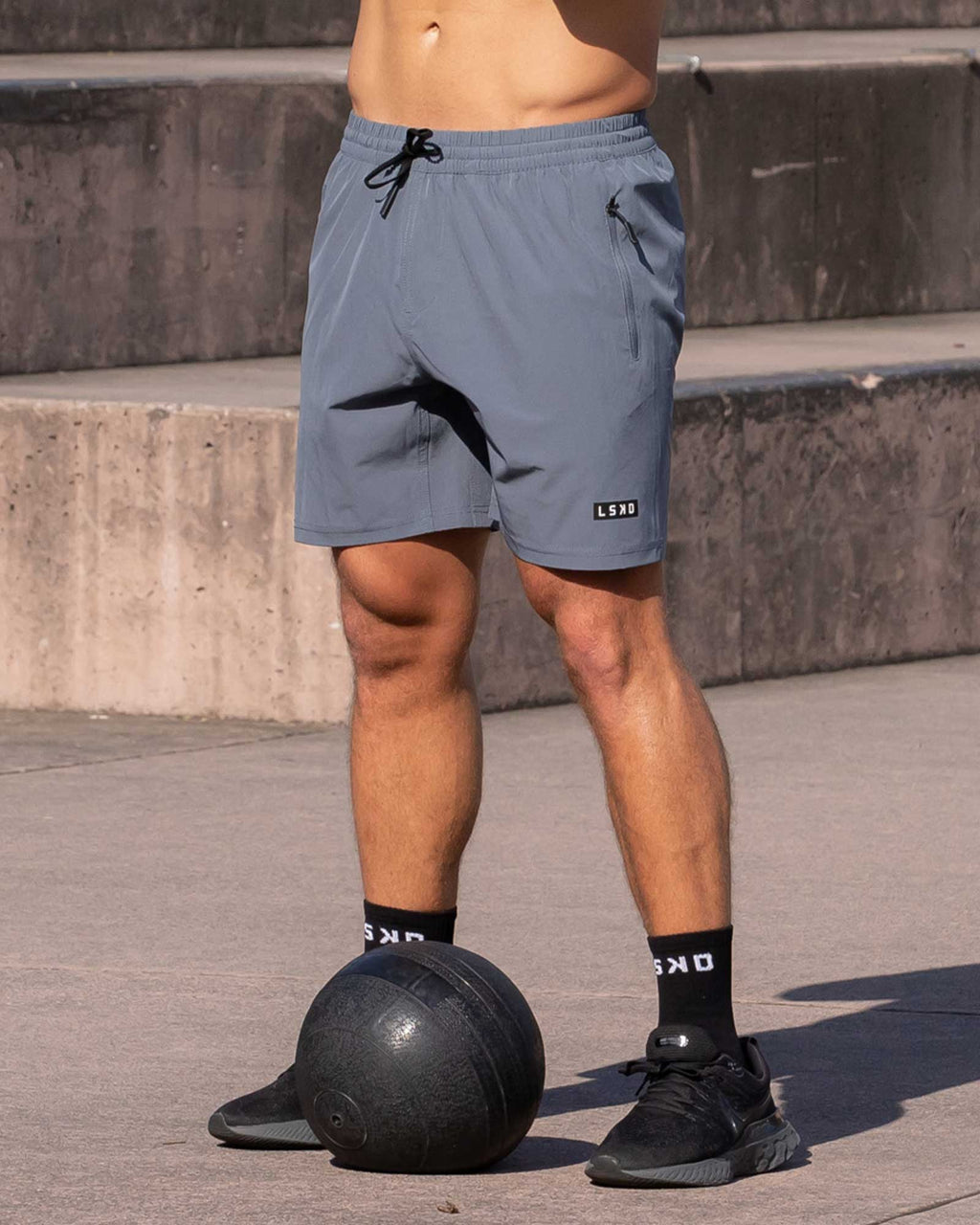 Model wearing Rep 7" Performance Short - Turbulence