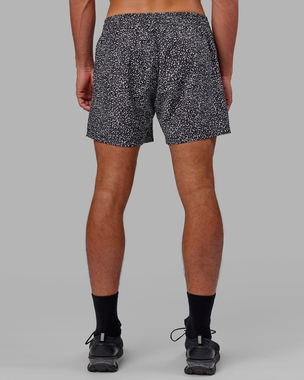 Model wearing Rep 5" Performance Short - Spotty Black-Alloy
