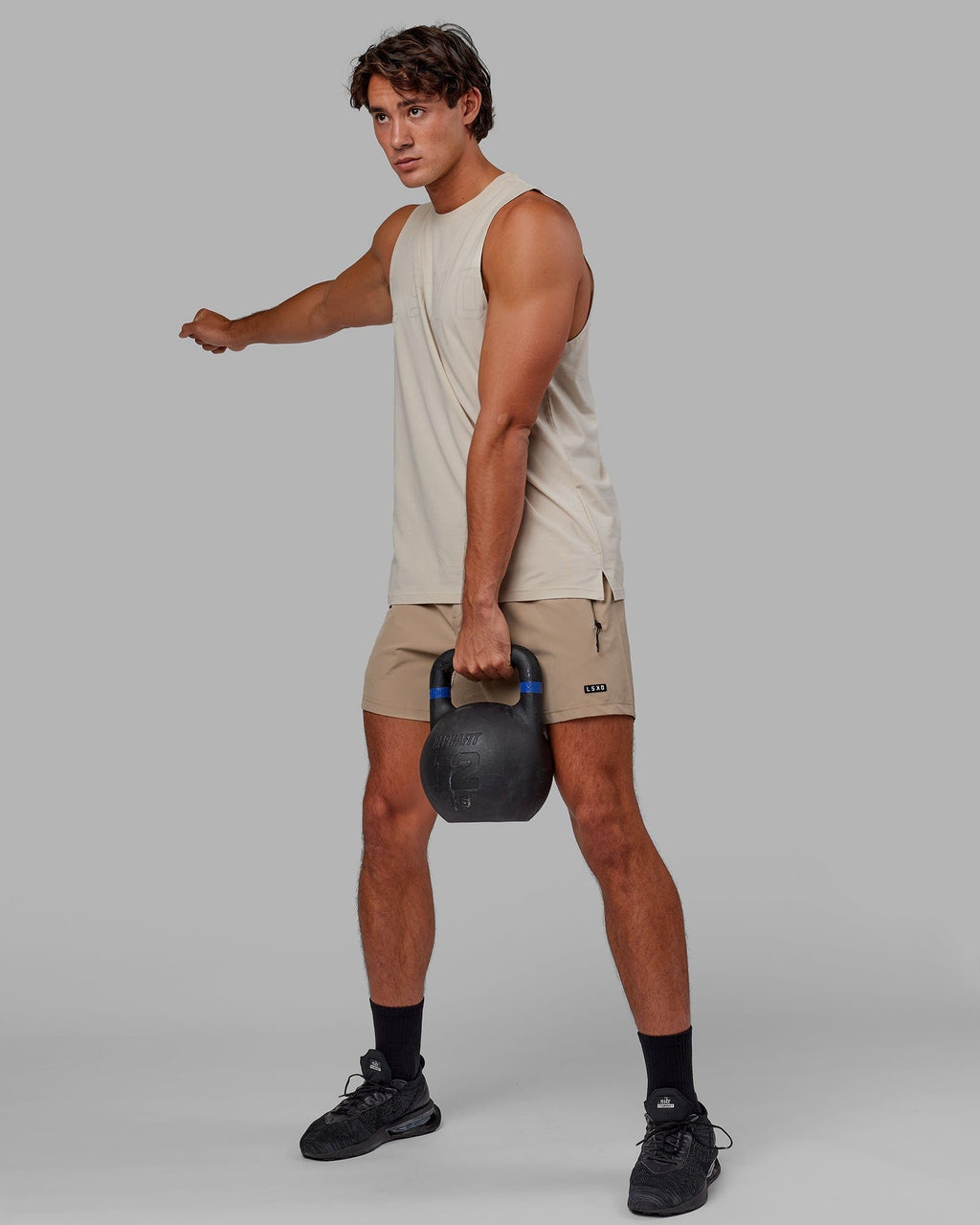 Model wearing Rep 5" Performance Short - Taupe