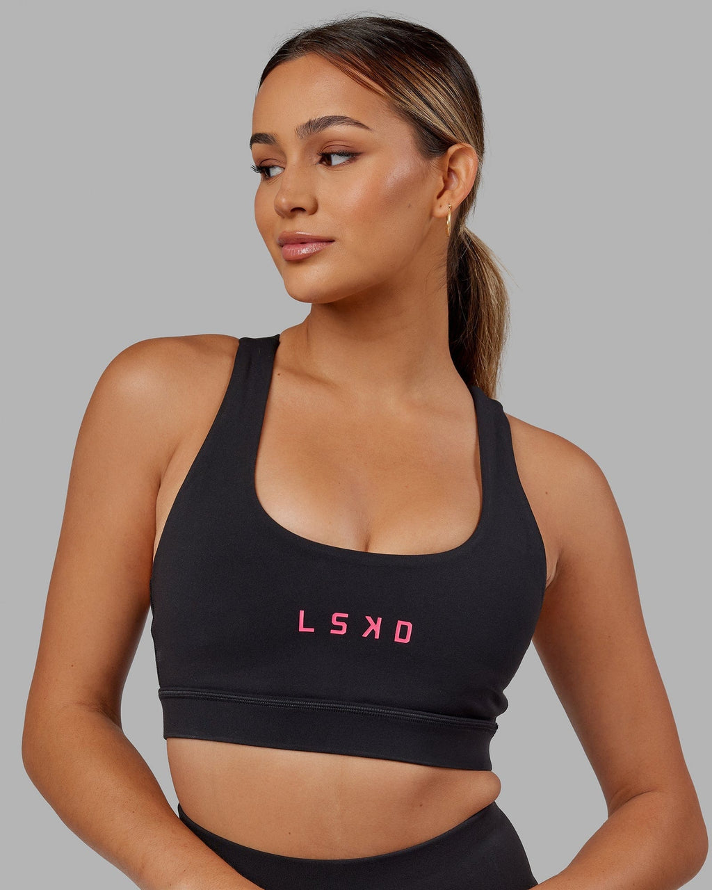 Model wearing Rep Sports Bra Small Logo - Black-Boysenberry