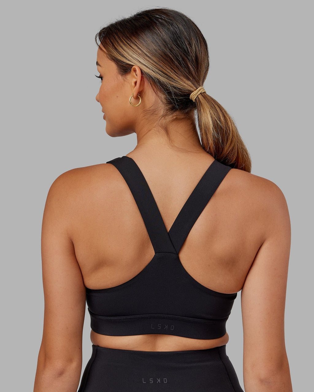 Model wearing Rep Sports Bra Small Logo - Black-Boysenberry