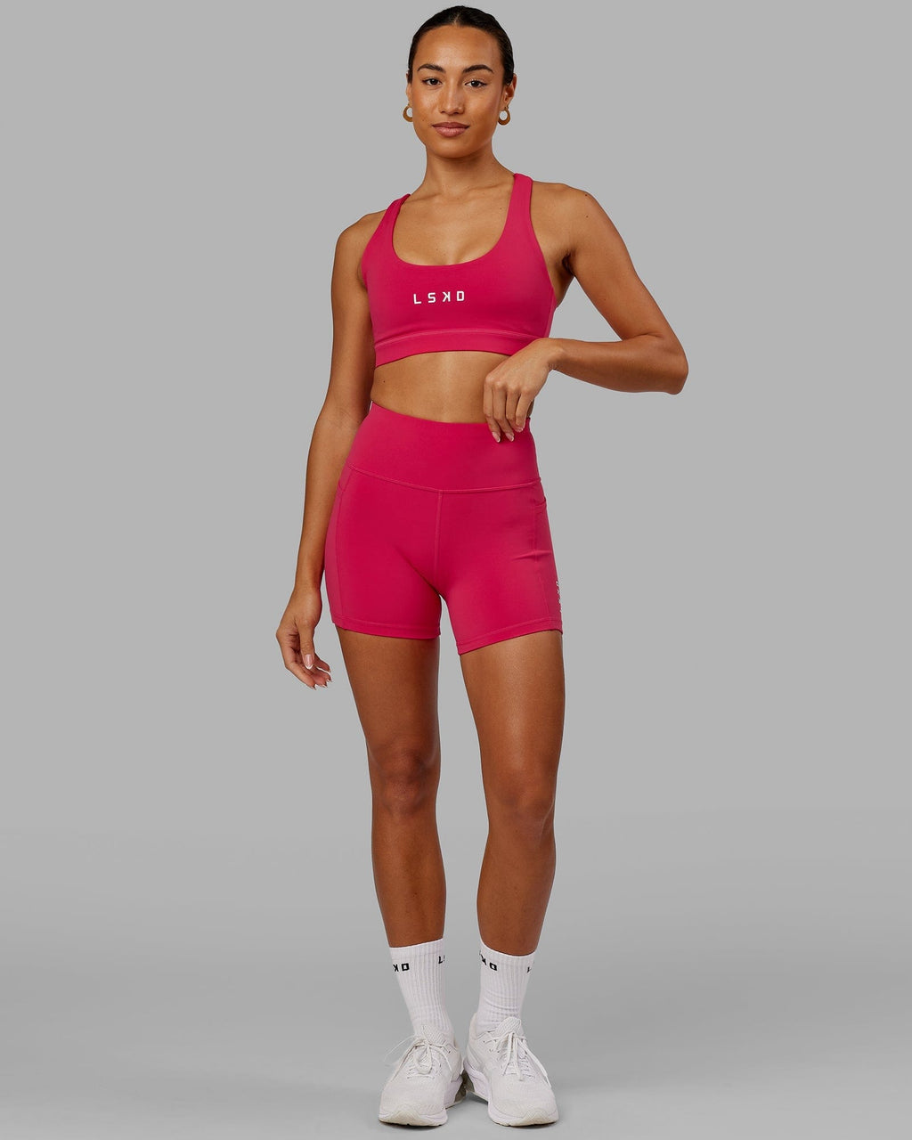 Model wearing Rep Sports Bra Small Logo - Boysenberry