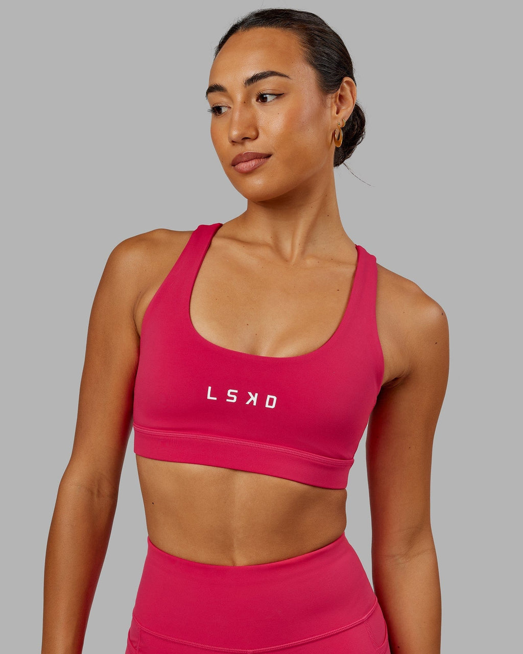 Model wearing Rep Sports Bra Small Logo - Boysenberry