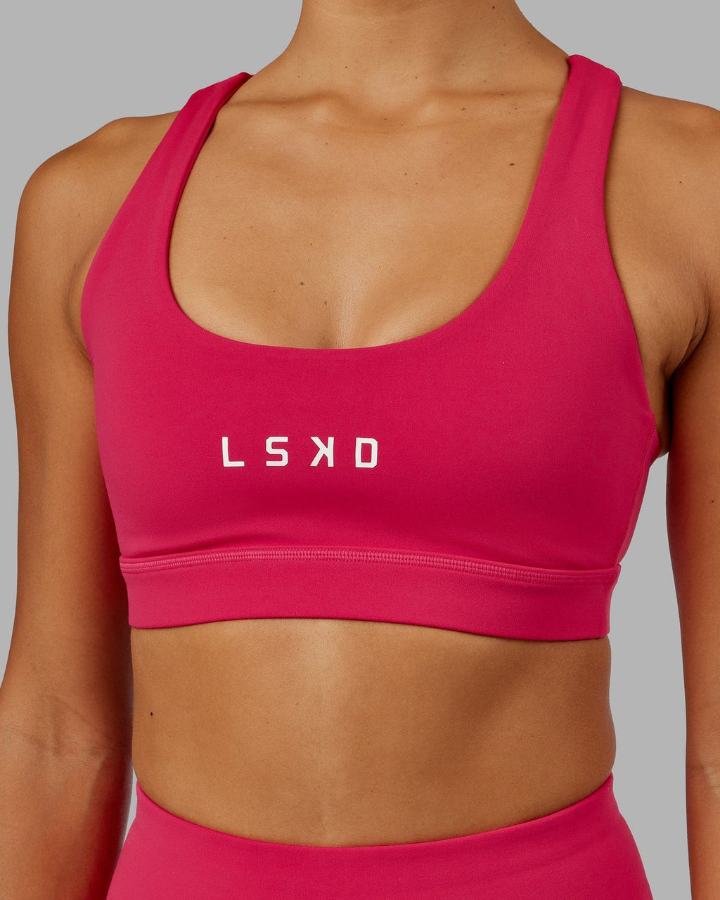 Model wearing Rep Sports Bra Small Logo - Boysenberry