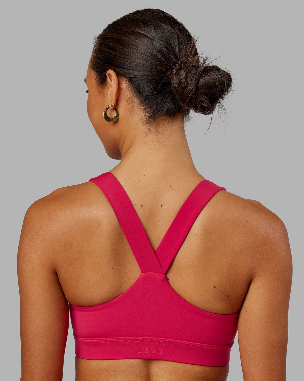 Model wearing Rep Sports Bra Small Logo - Boysenberry