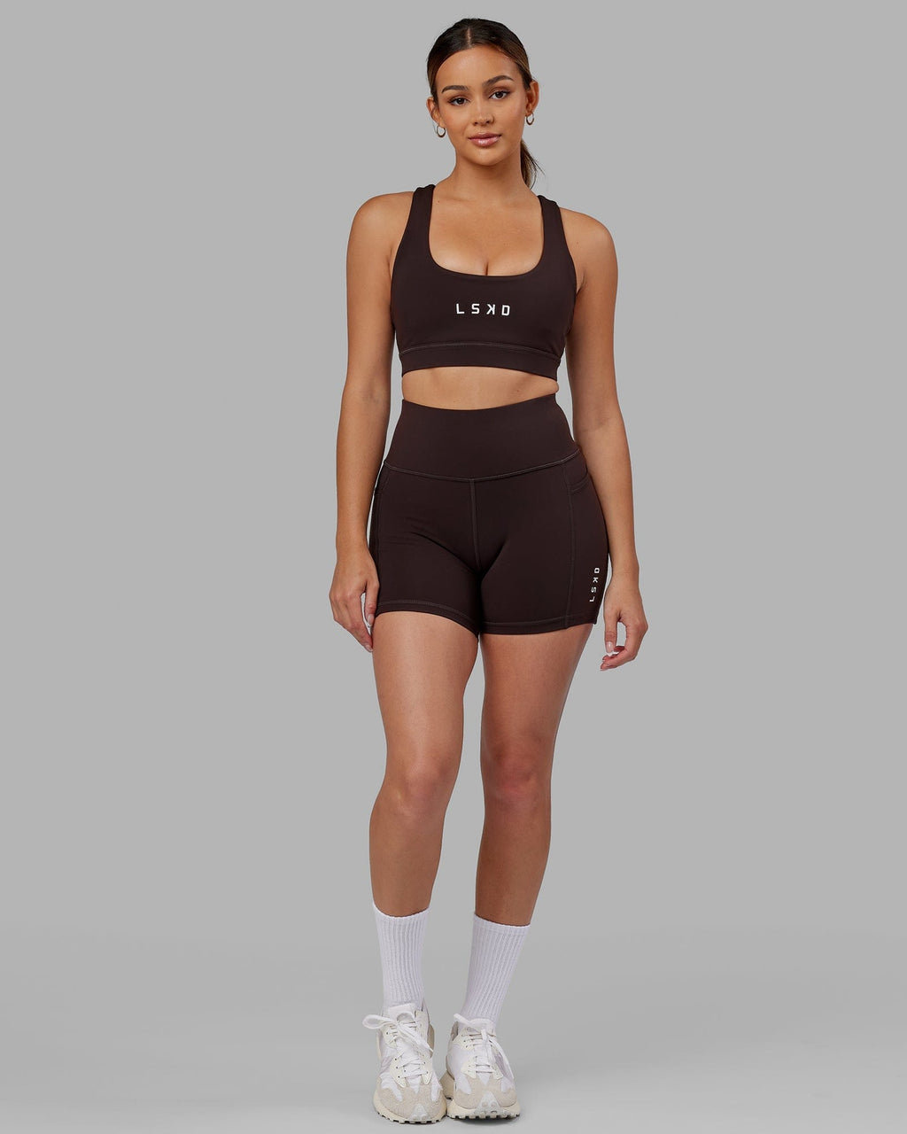 Model wearing Rep Sports Bra Small Logo - Dark Walnut