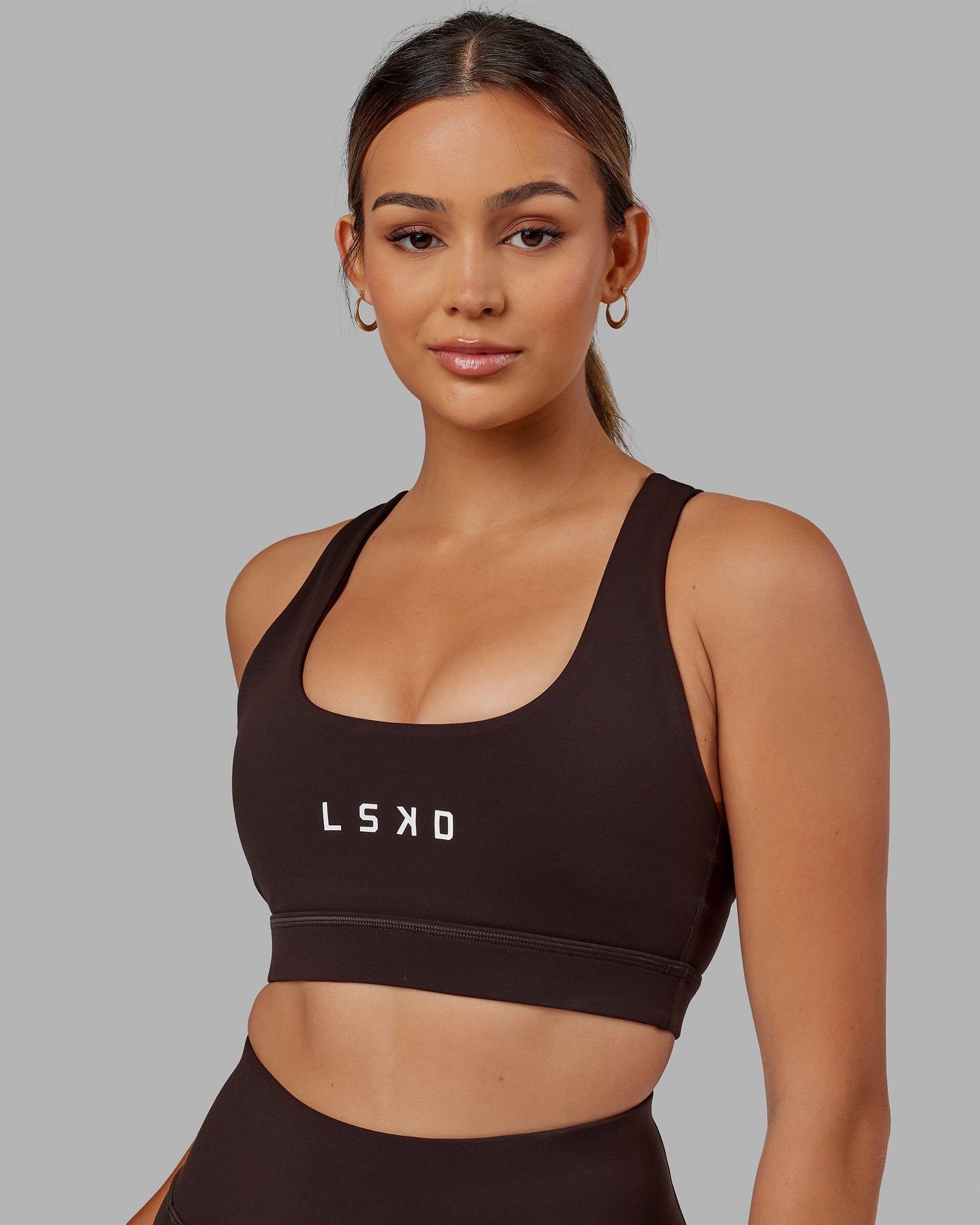 Model wearing Rep Sports Bra Small Logo - Dark Walnut