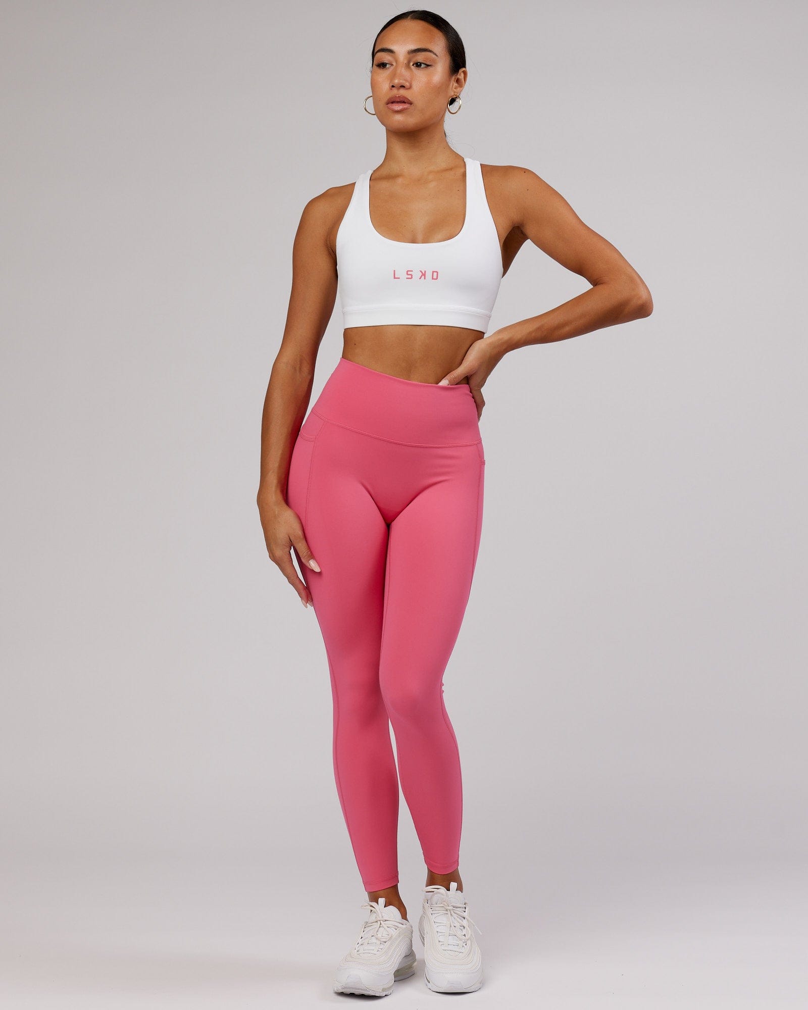 Model wearing Rep Sports Bra Small Logo - White-Flamingo