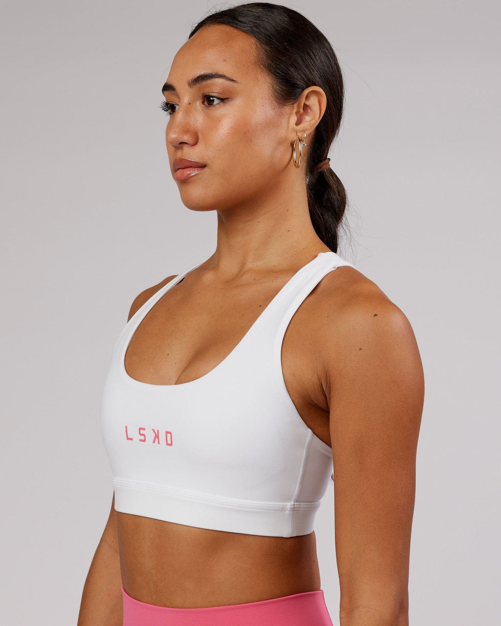 Model wearing Rep Sports Bra Small Logo - White-Flamingo