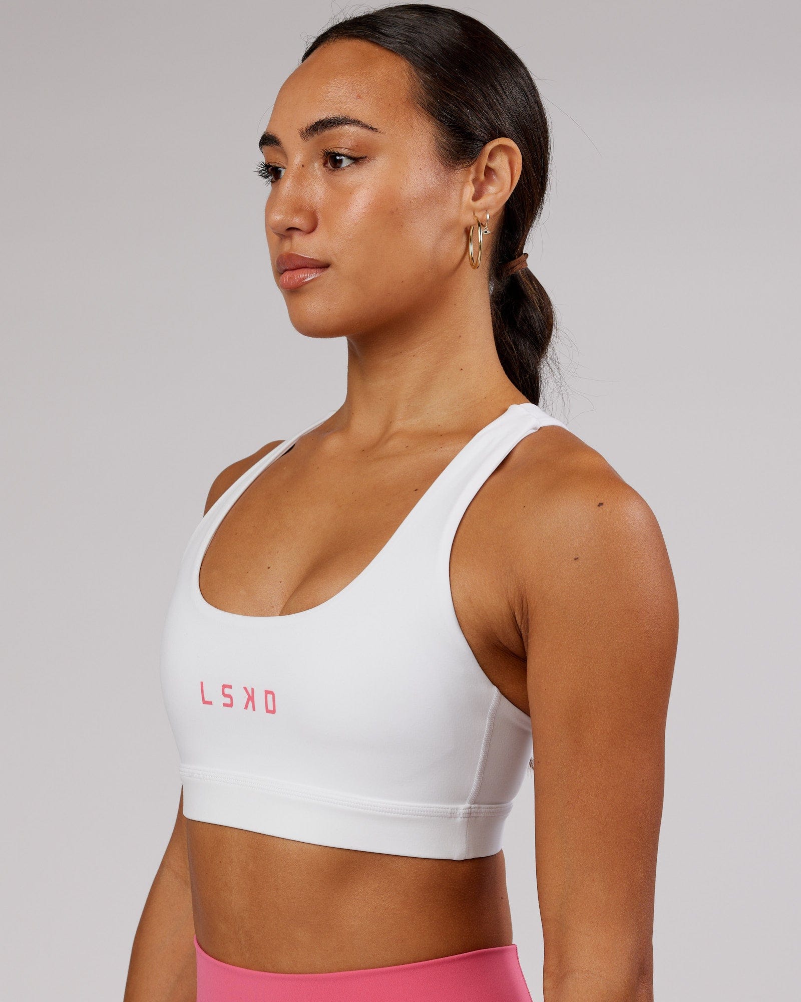 Model wearing Rep Sports Bra Small Logo - White-Flamingo