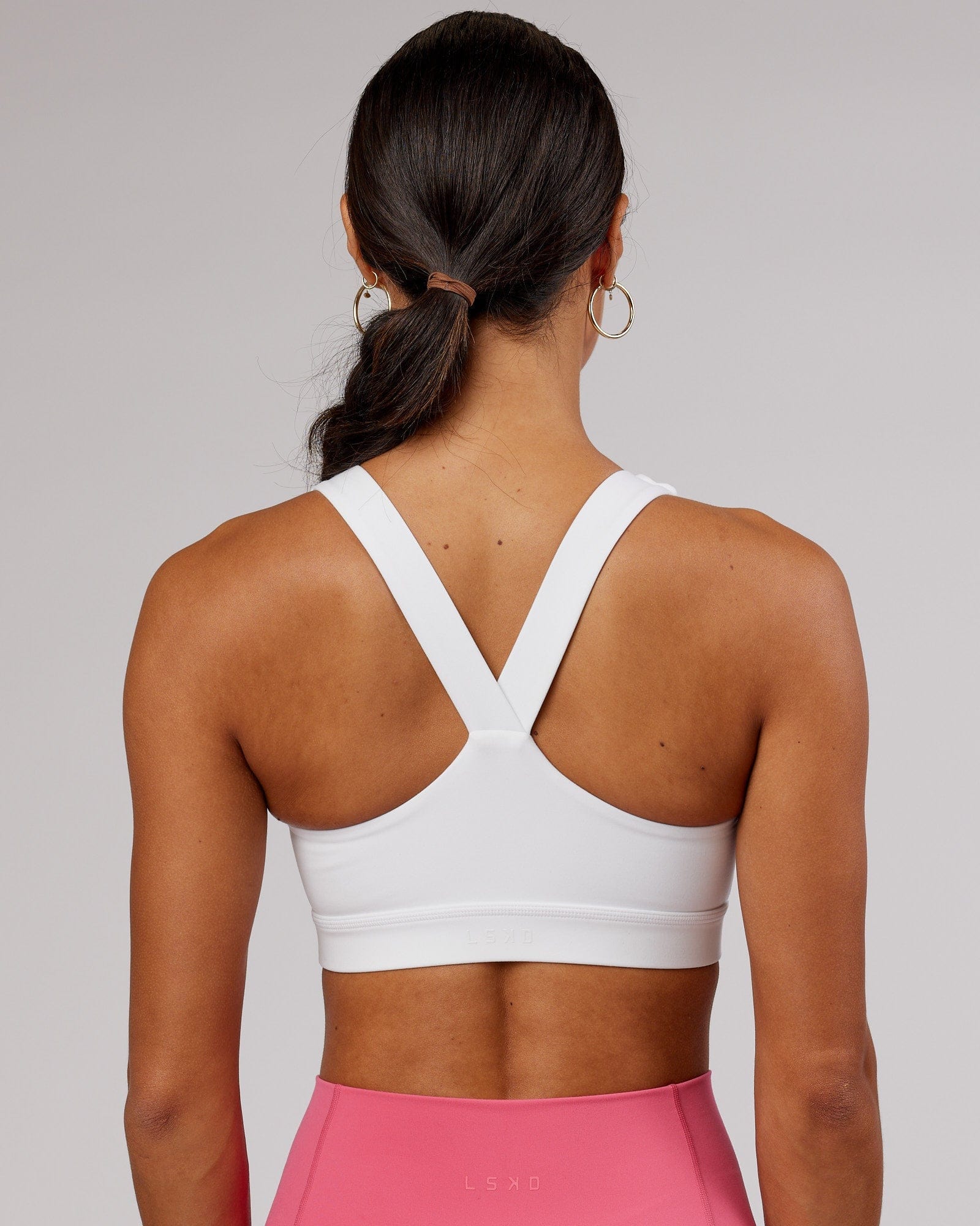 Model wearing Rep Sports Bra Small Logo - White-Flamingo
