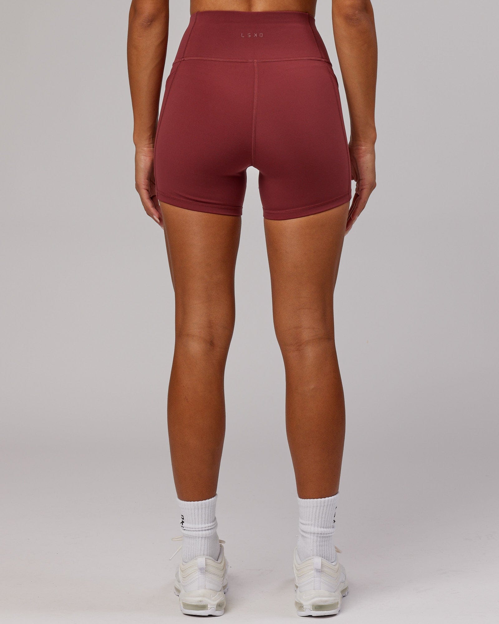 Model wearing Rep X-Short Tight - Apple Berry