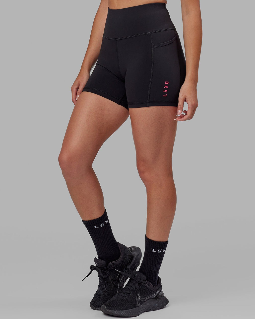 Model wearing Rep X-Short Tight - Black-Boysenberry