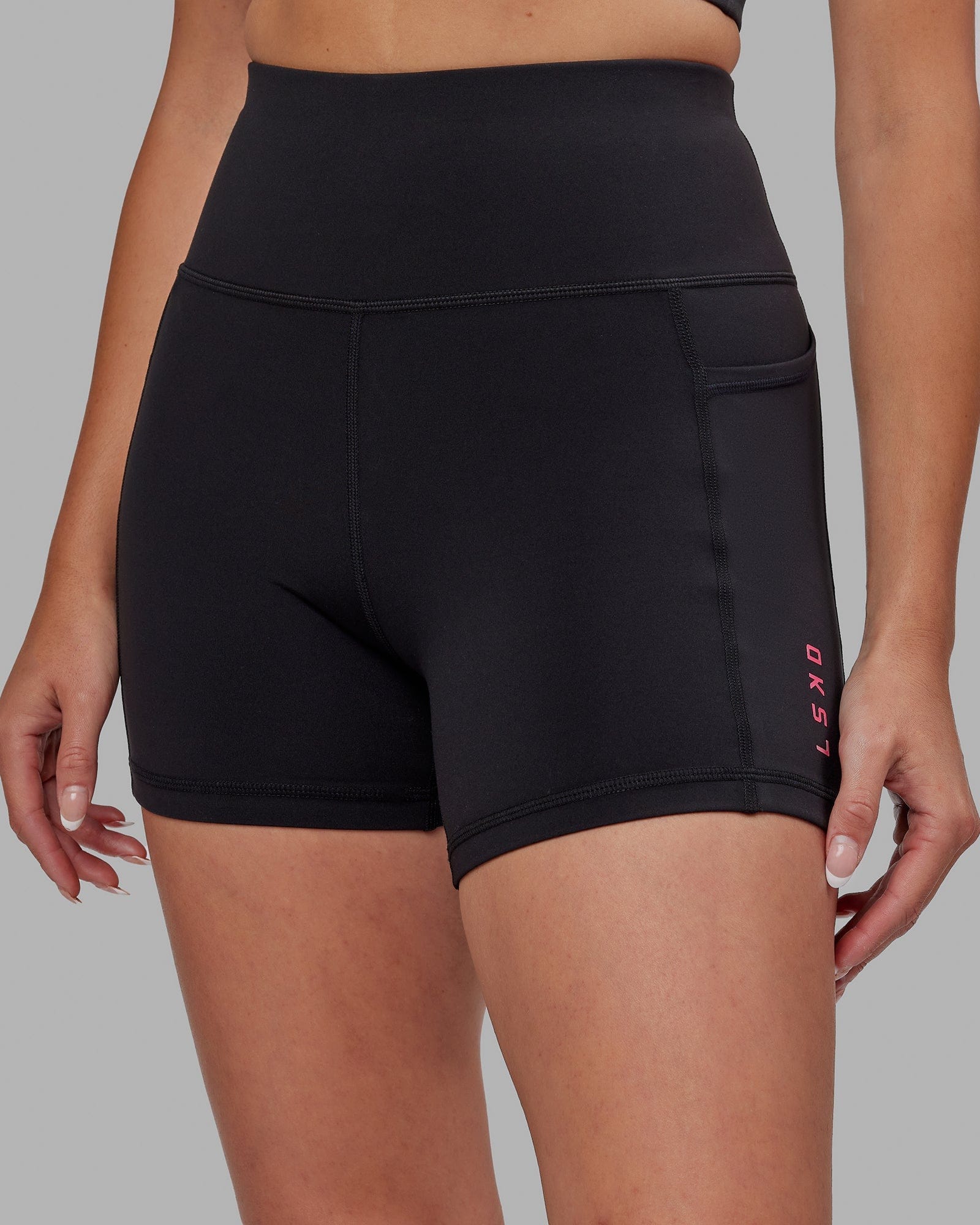 Model wearing Rep X-Short Tight - Black-Boysenberry